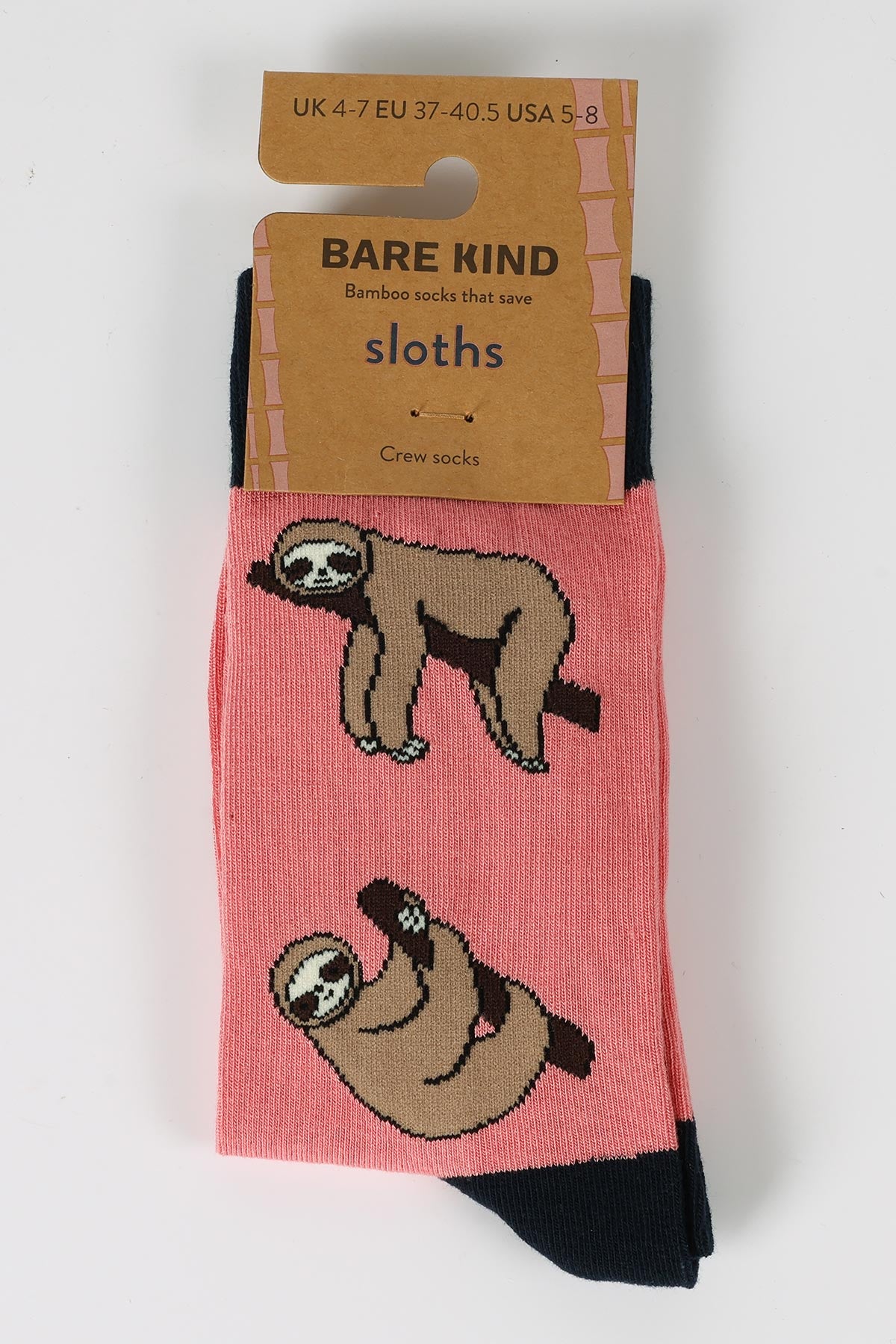 Pink bamboo sloth crew socks by Bare Kind in recyclable card sleeve packaging — Urban Wild