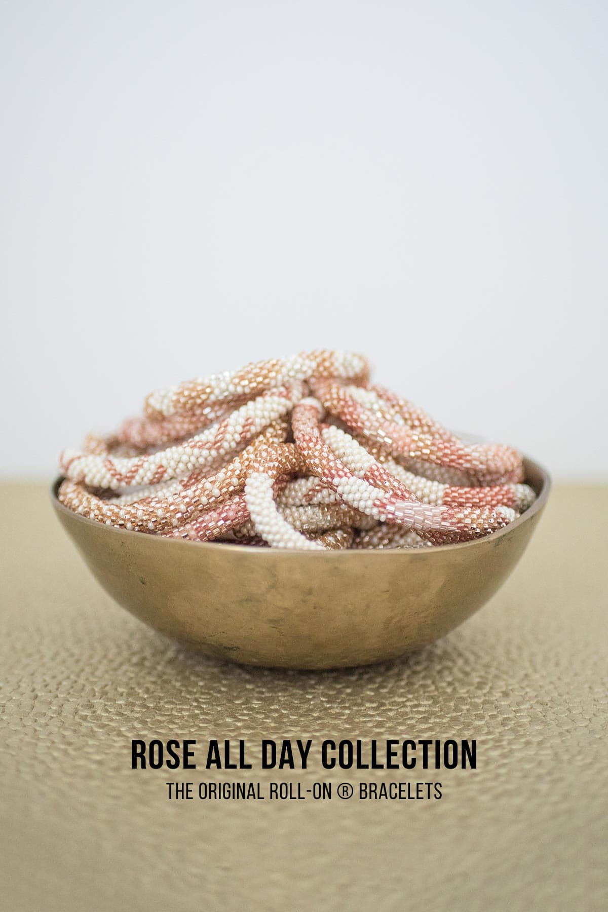 Rose All Day beaded Roll-On bracelets in brass bowl pink gold and white - Urban Wild