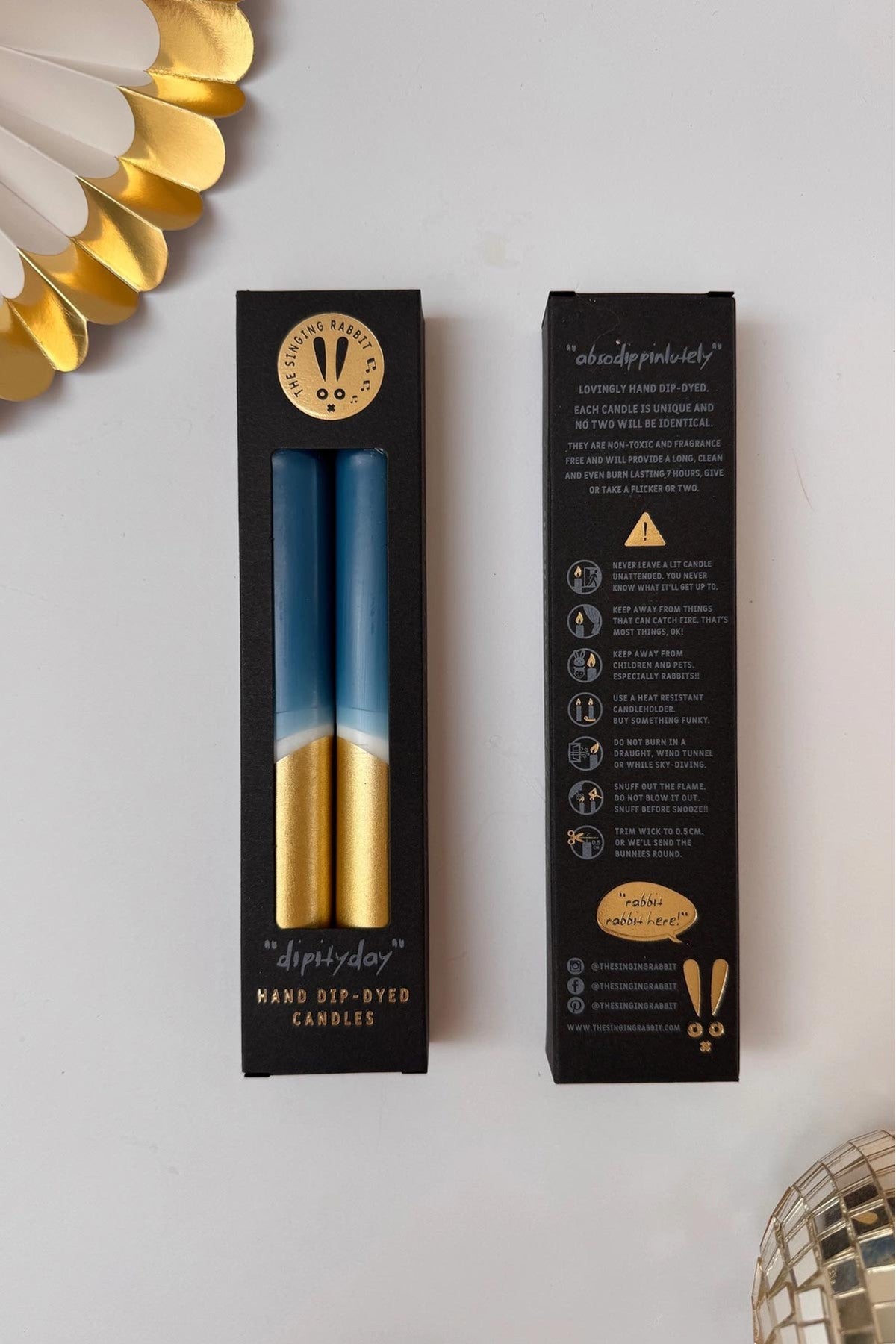 Colourful taper dinner candles in teal and gold displayed together — Urban Wild