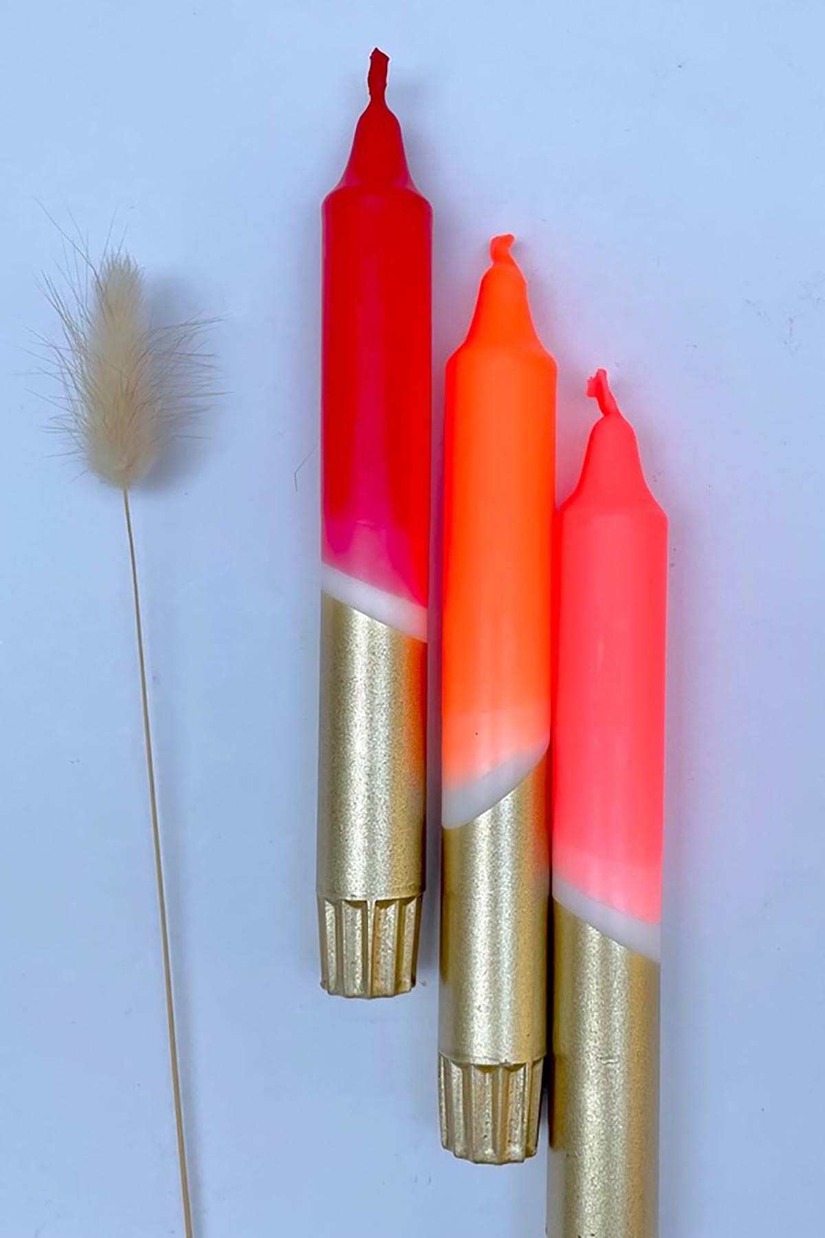 The Singing Rabbit Red, Neon Coral, Neon Orange & Gold Dip Dyed Dinner Candles Set Of 3