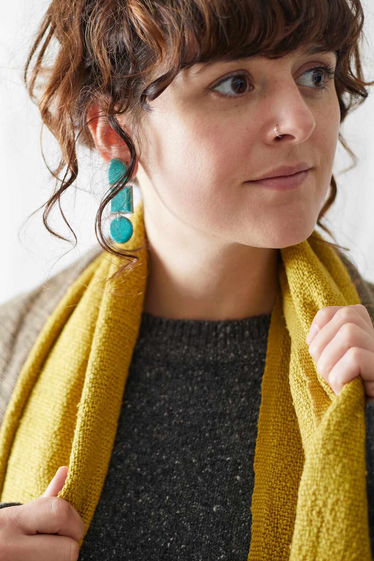 Model wearing Aura Que Bibek scarf in mustard yellow