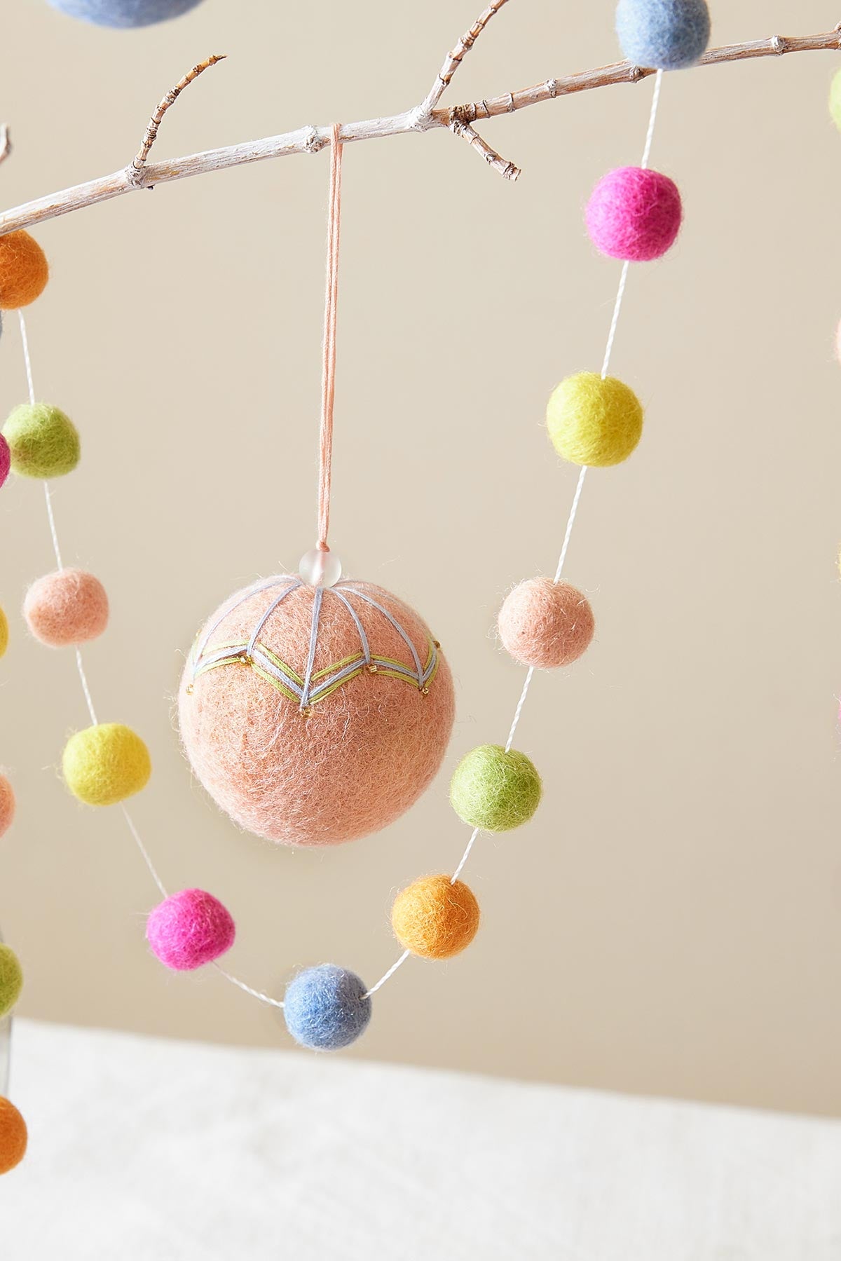 Hanging felt bauble in pink grapefruit