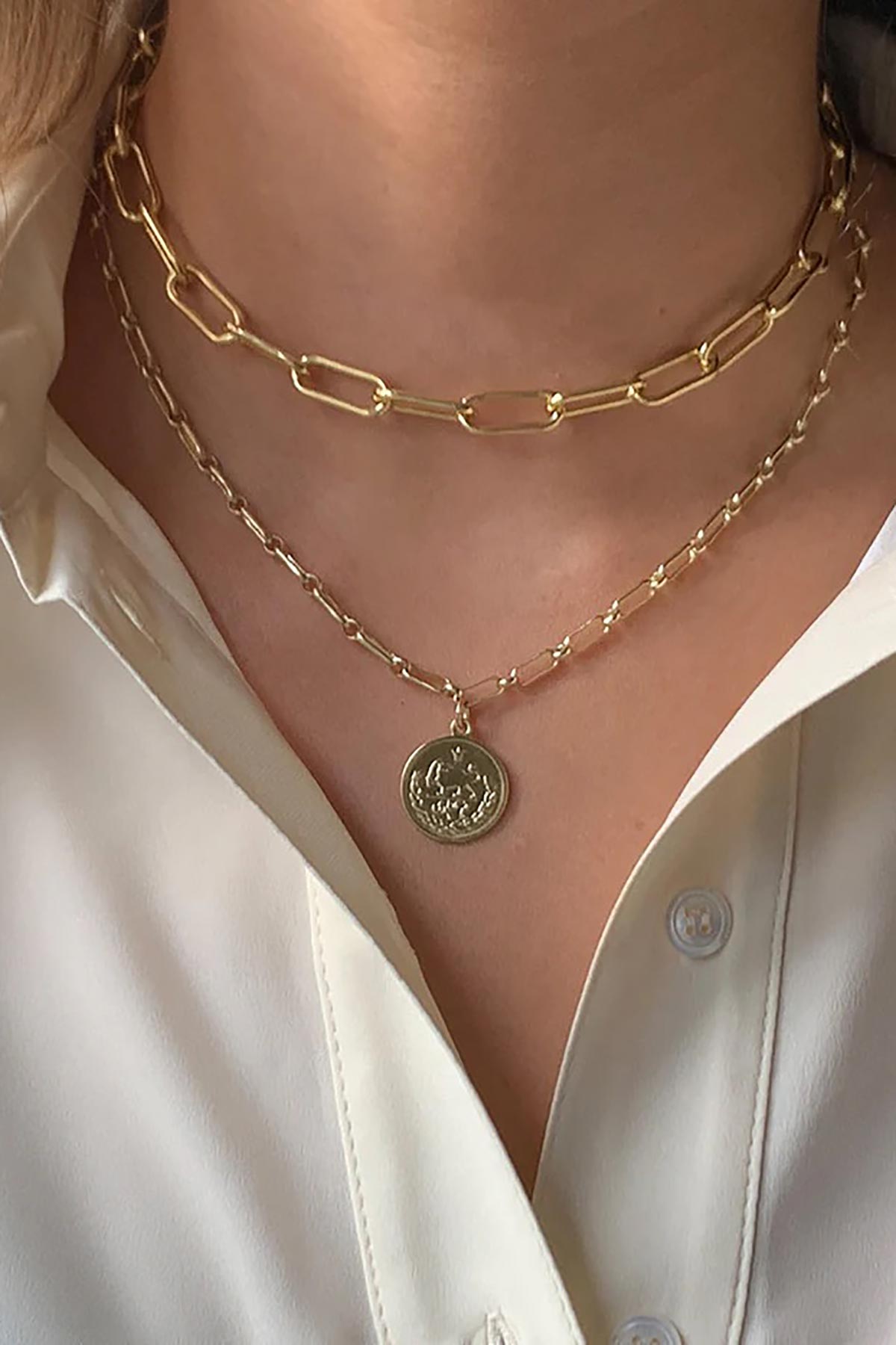 Notus gold chain necklace worn layered