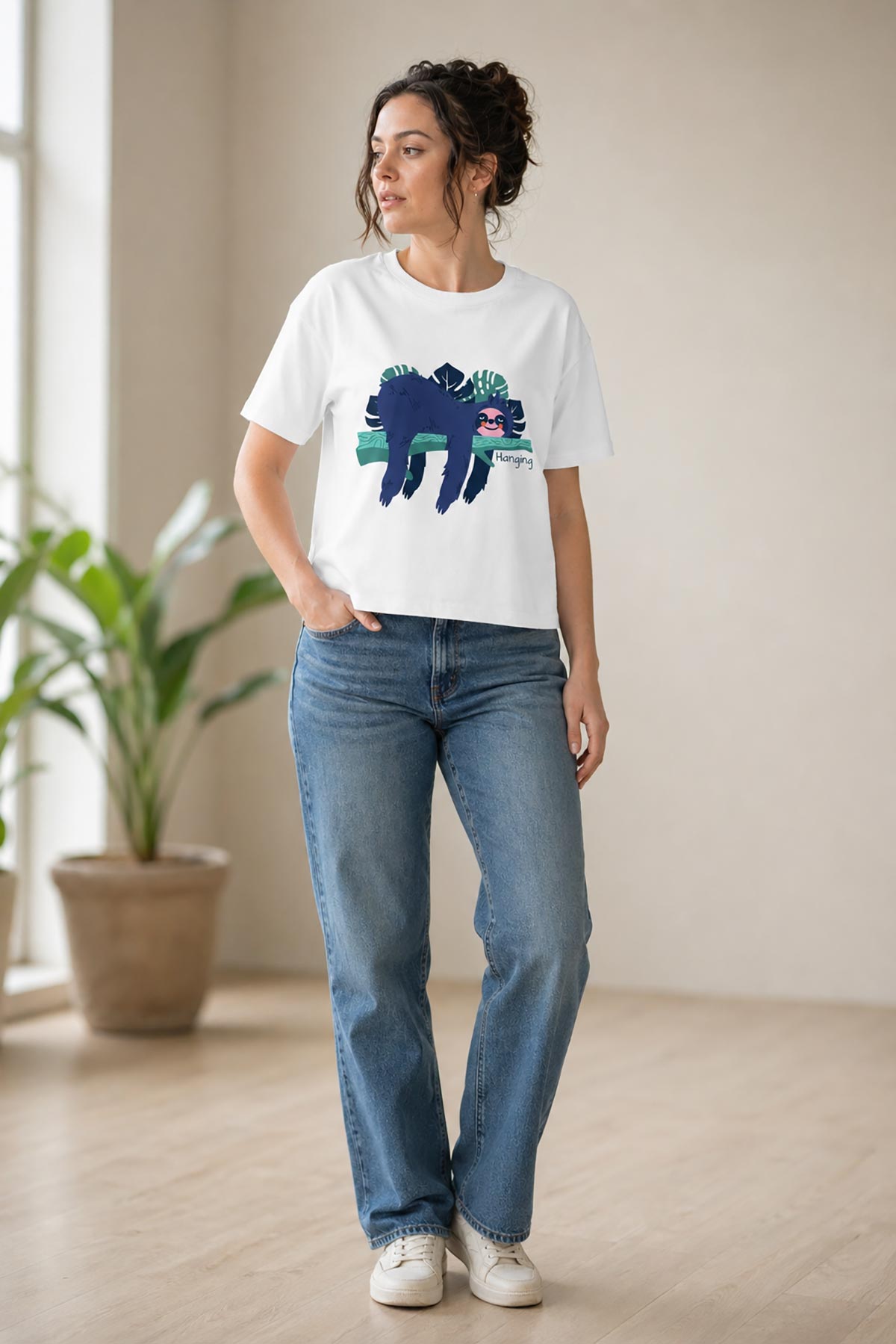 Model wearing circular organic cotton sloth print t-shirt by Urban Wild in relaxed fit