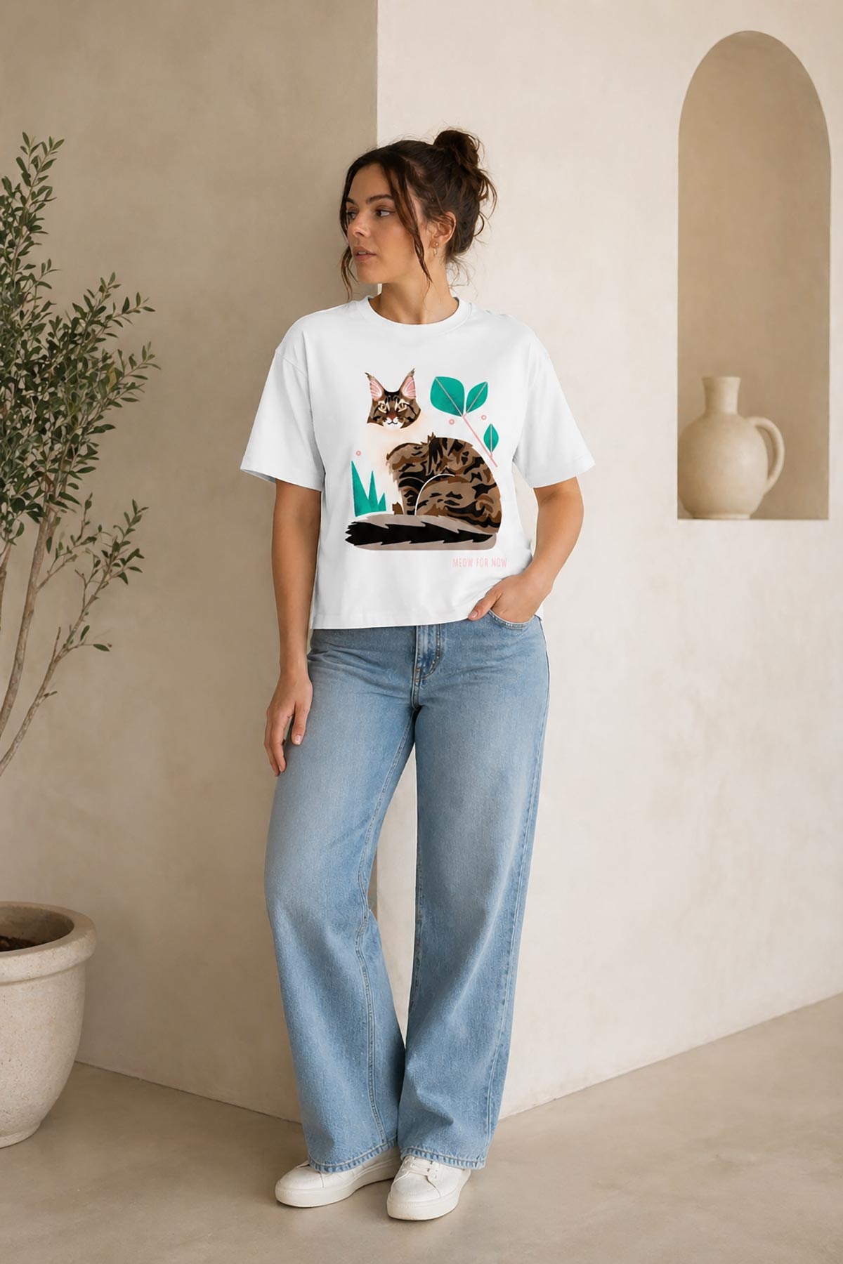 Model wearing circular organic cotton cat print t-shirt by Urban Wild in relaxed fit