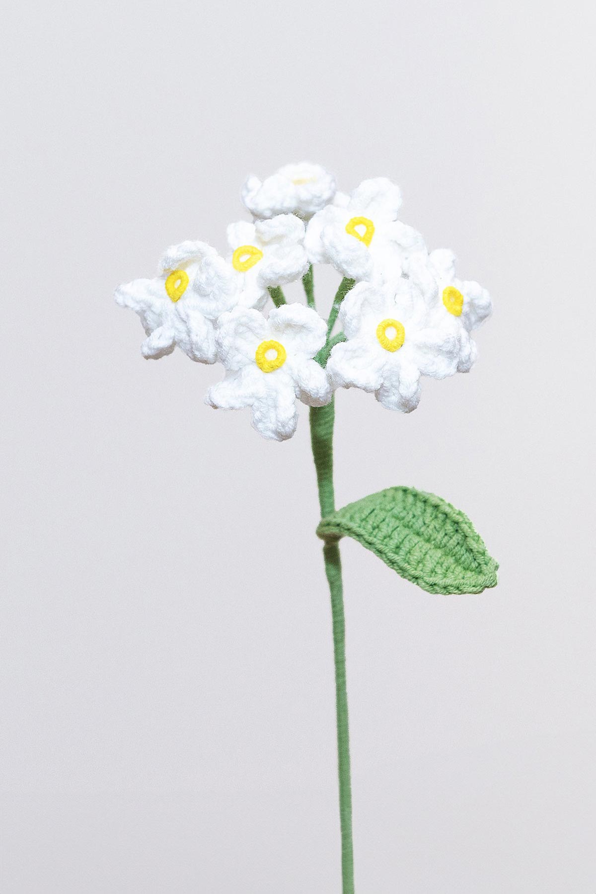 Detail of handmade crochet forget me not petals