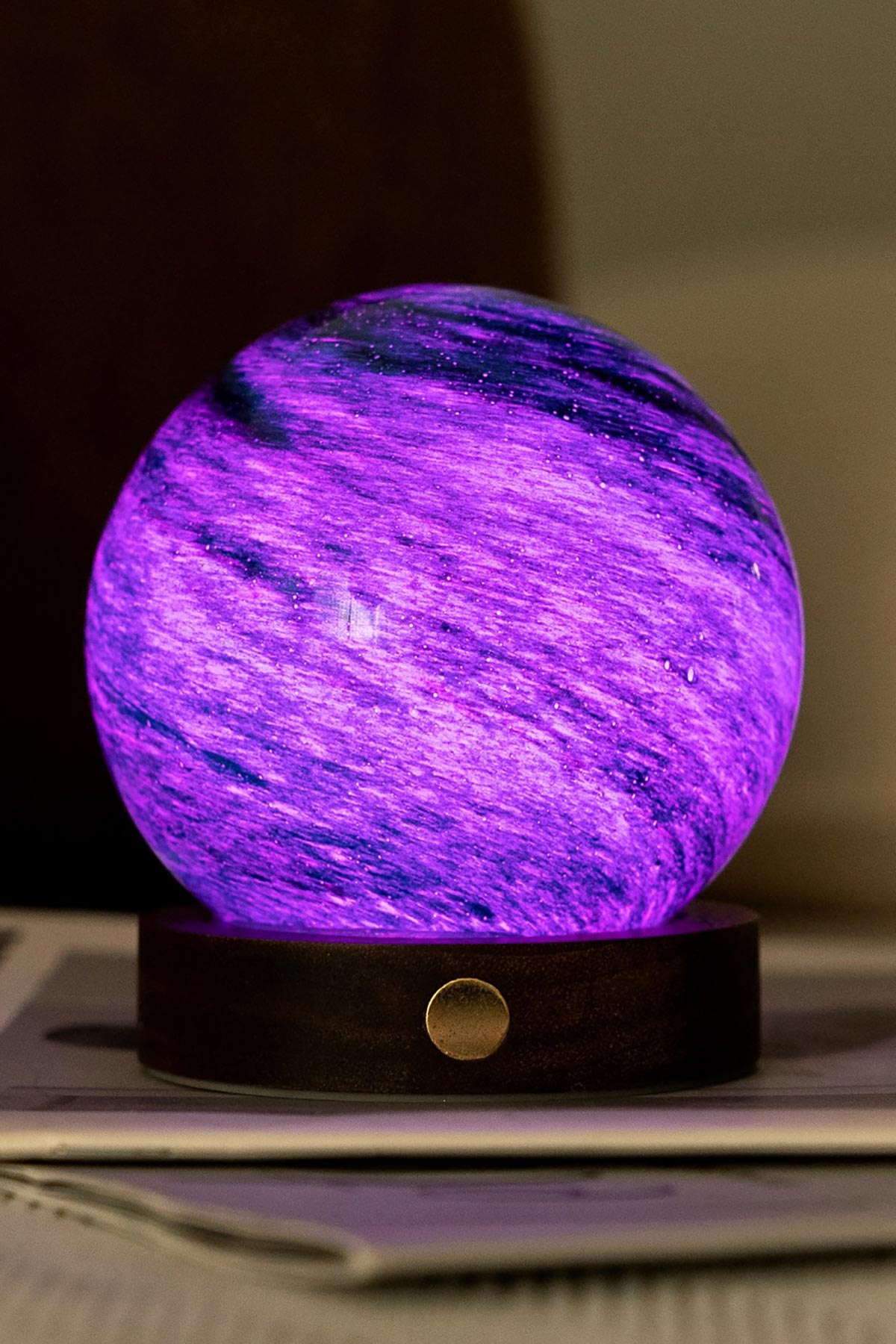 Illuminated purple Stellar Ocean LED glass orb