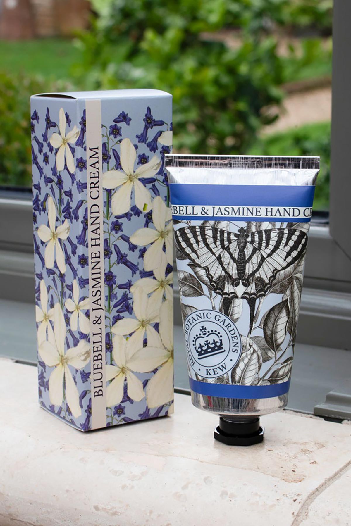 Close-up detail of Kew Gardens Bluebell and Jasmine Hand Cream floral tube design