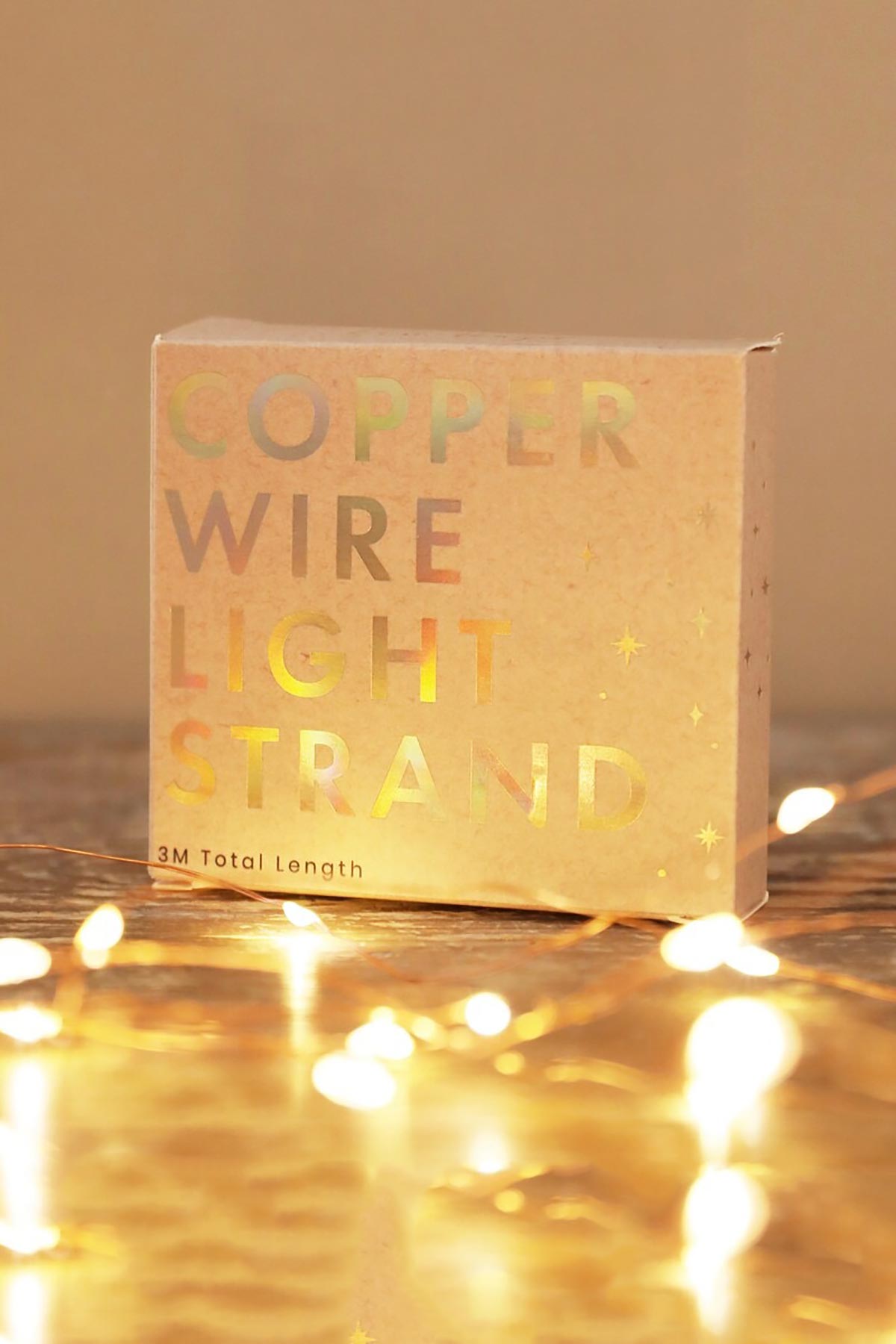 Lisa Angel 30 Battery Powered LED Copper Wire String Lights glowing on table surface