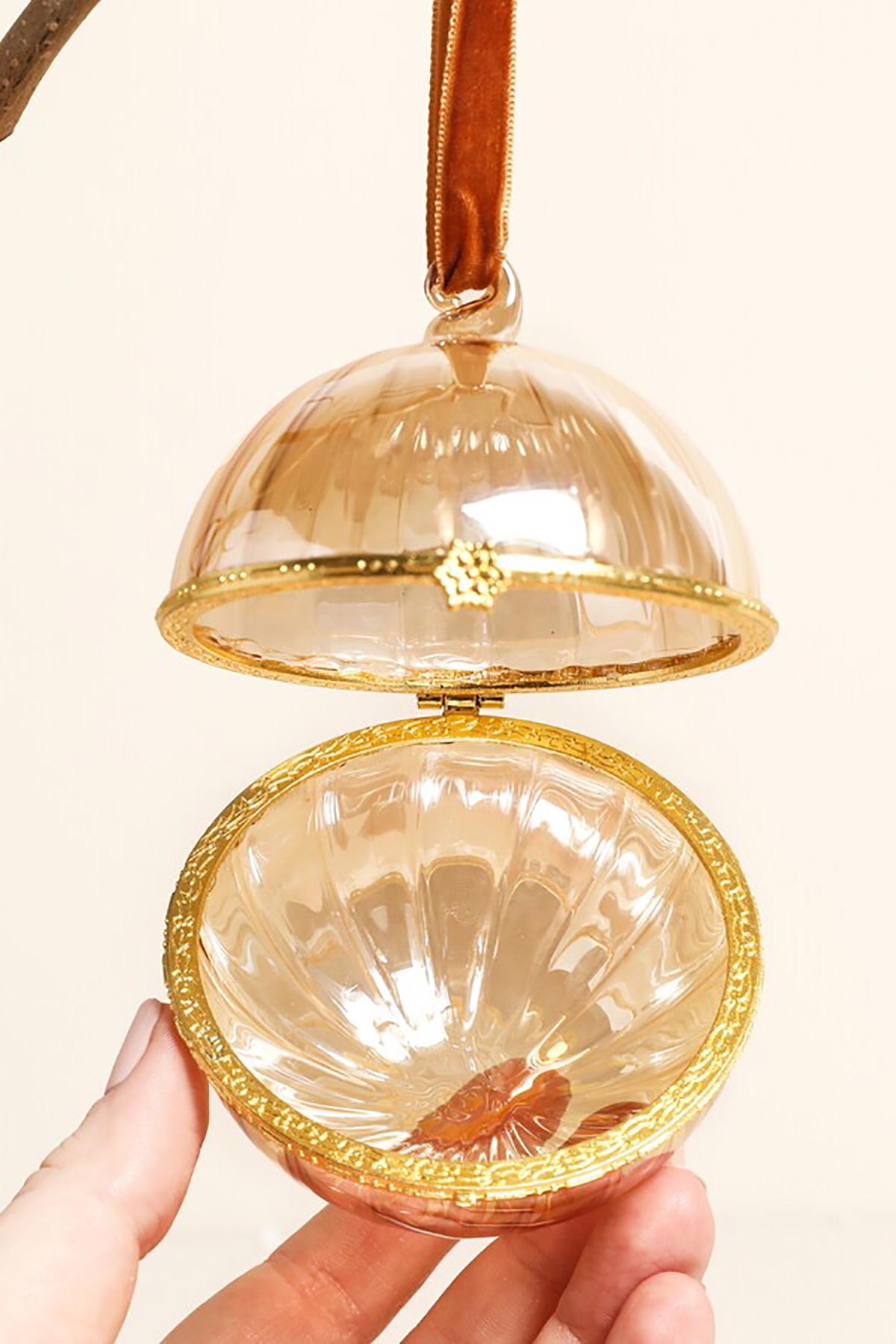 Lisa Angel Amber Glass Gold Bauble open to show interior space