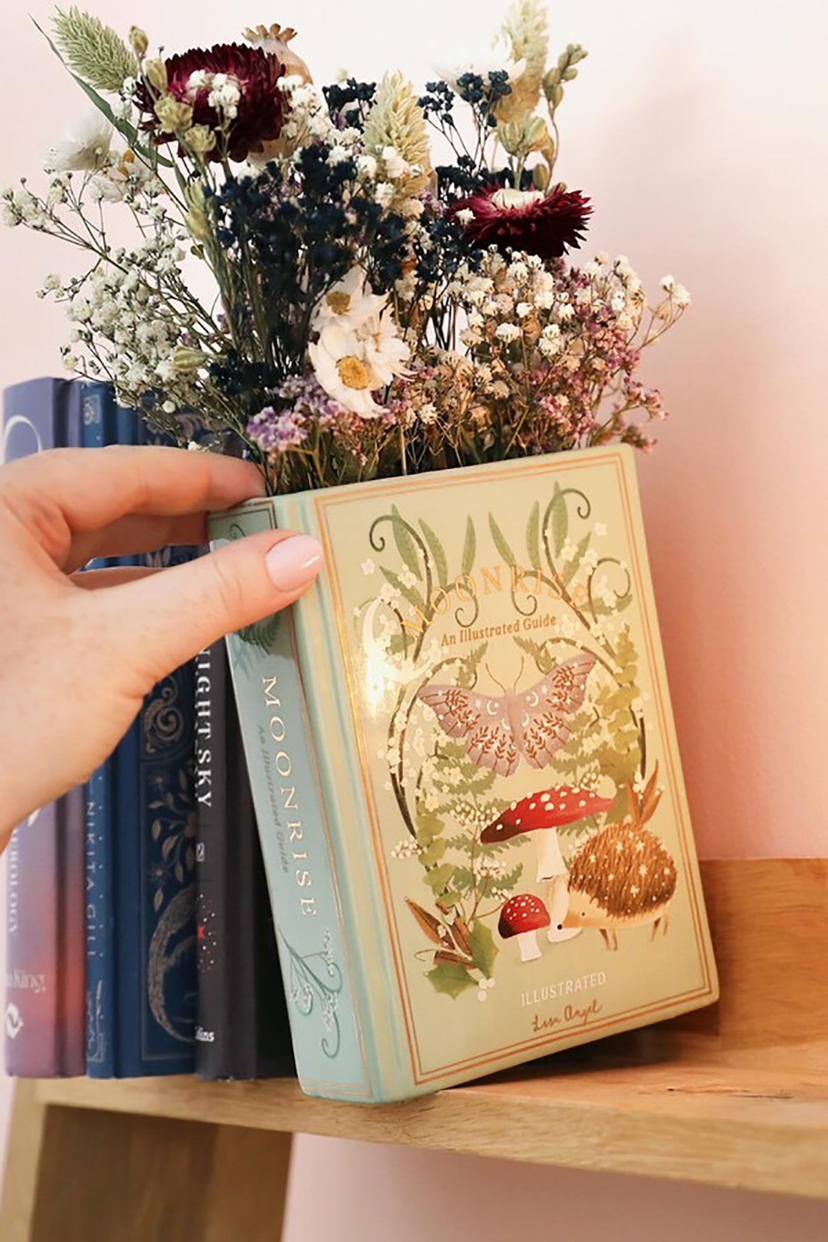 Lisa Angel Ceramic Moonrise Woodland Book Vase showing moonlit forest design