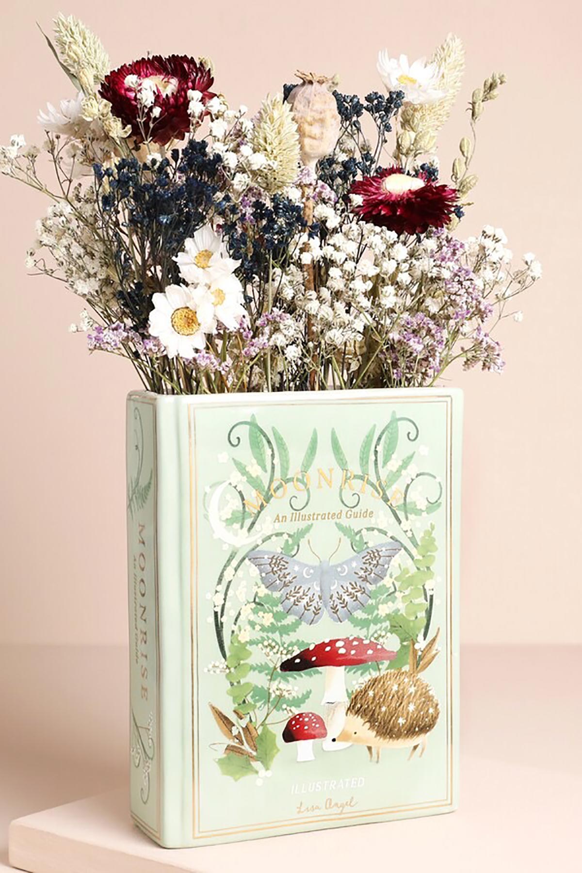 Lisa Angel Ceramic Moonrise Woodland Book Vase on table with flowers