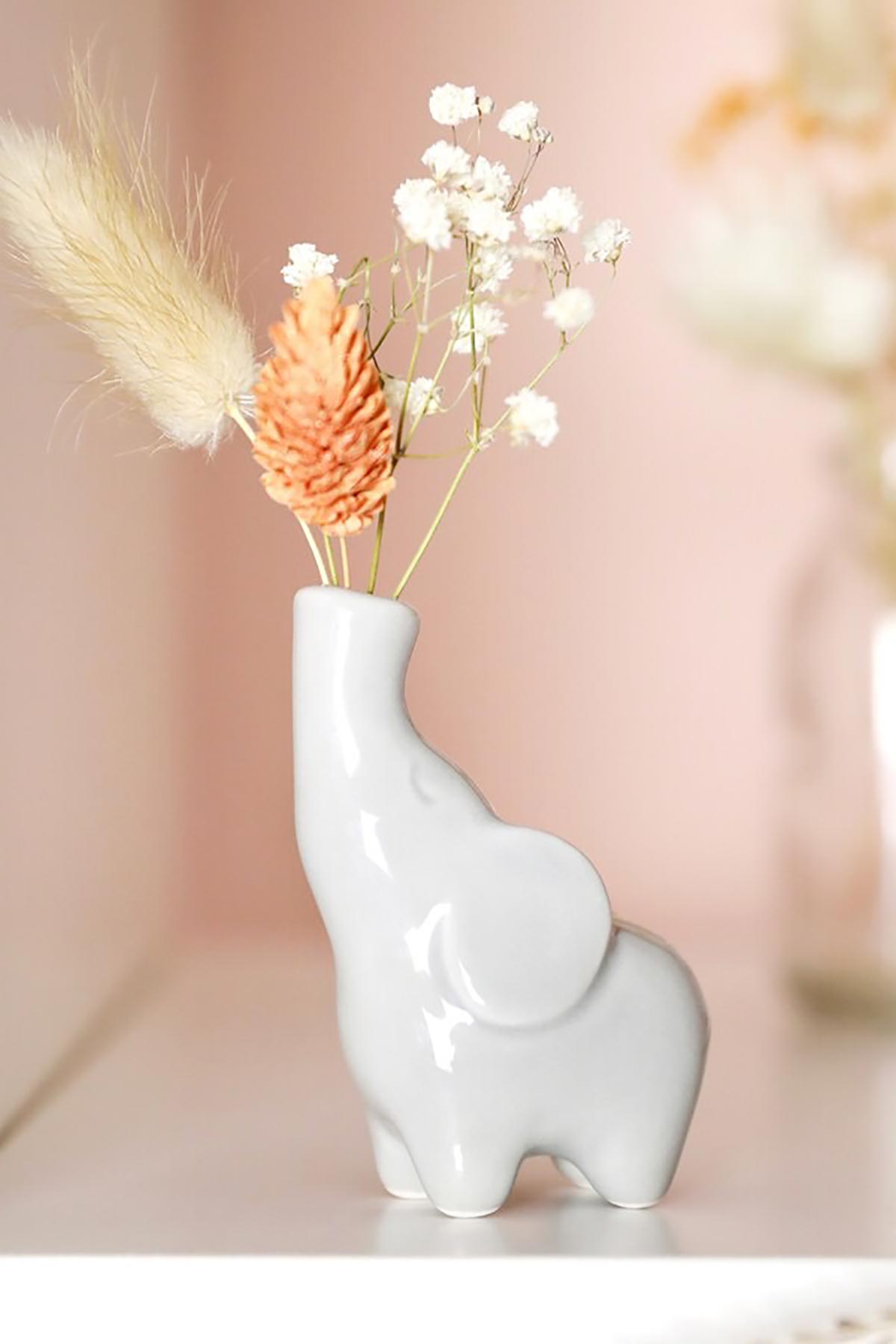 Elephant bud vase styled on shelf