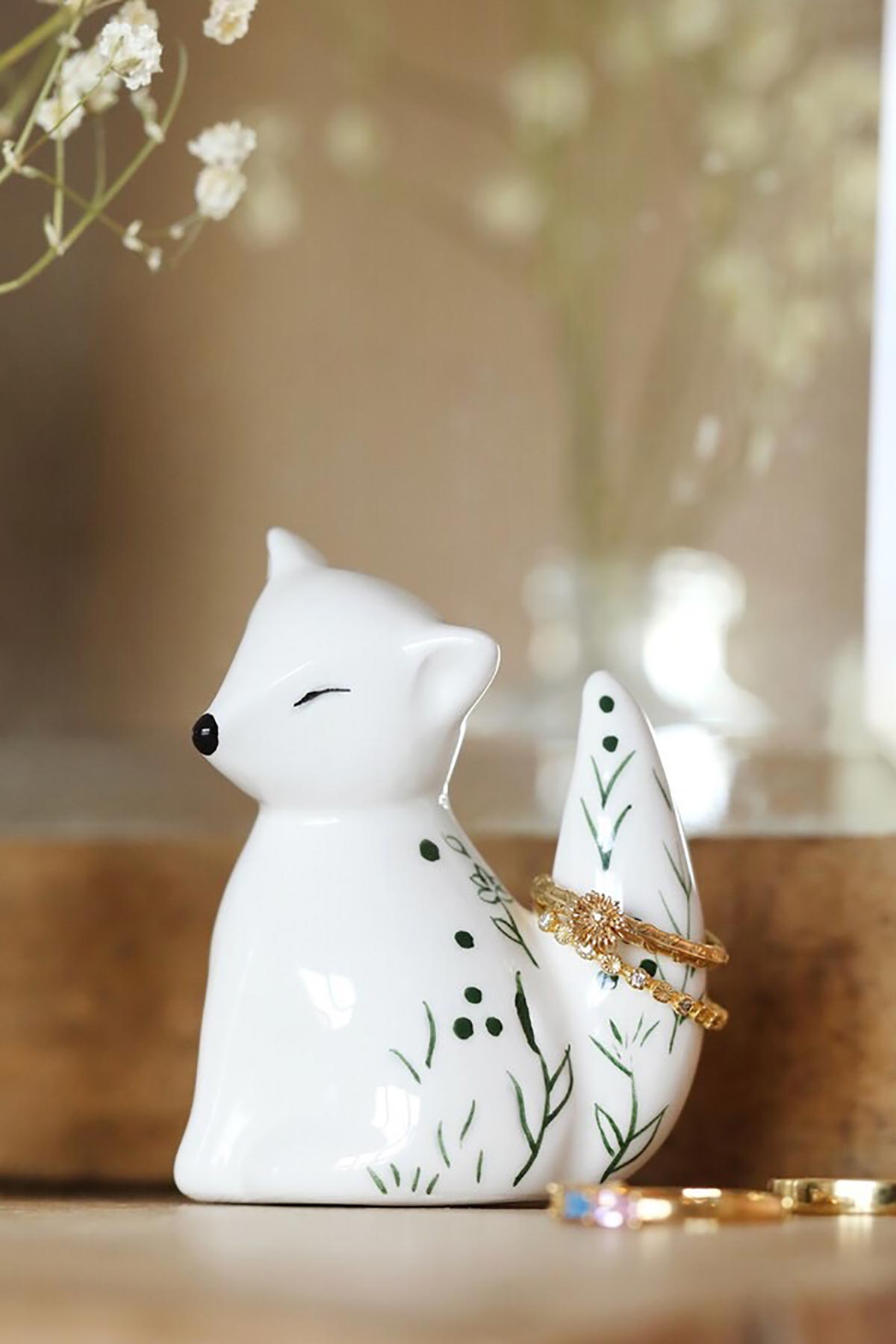 Close-up of ceramic fox ring stand