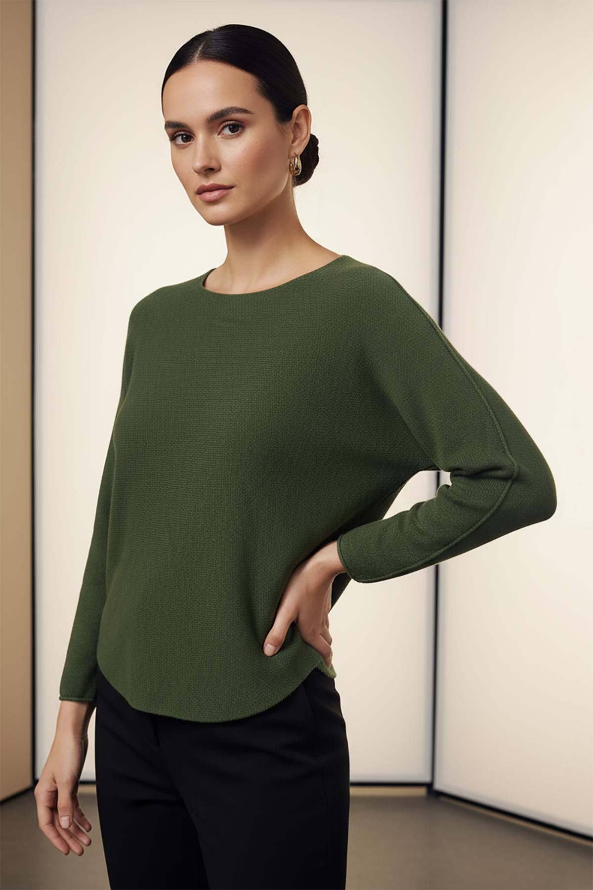 Model wearing forest green reversible seamless knit jumper made in Italy – elegant Italian knitwear by Urban Wild