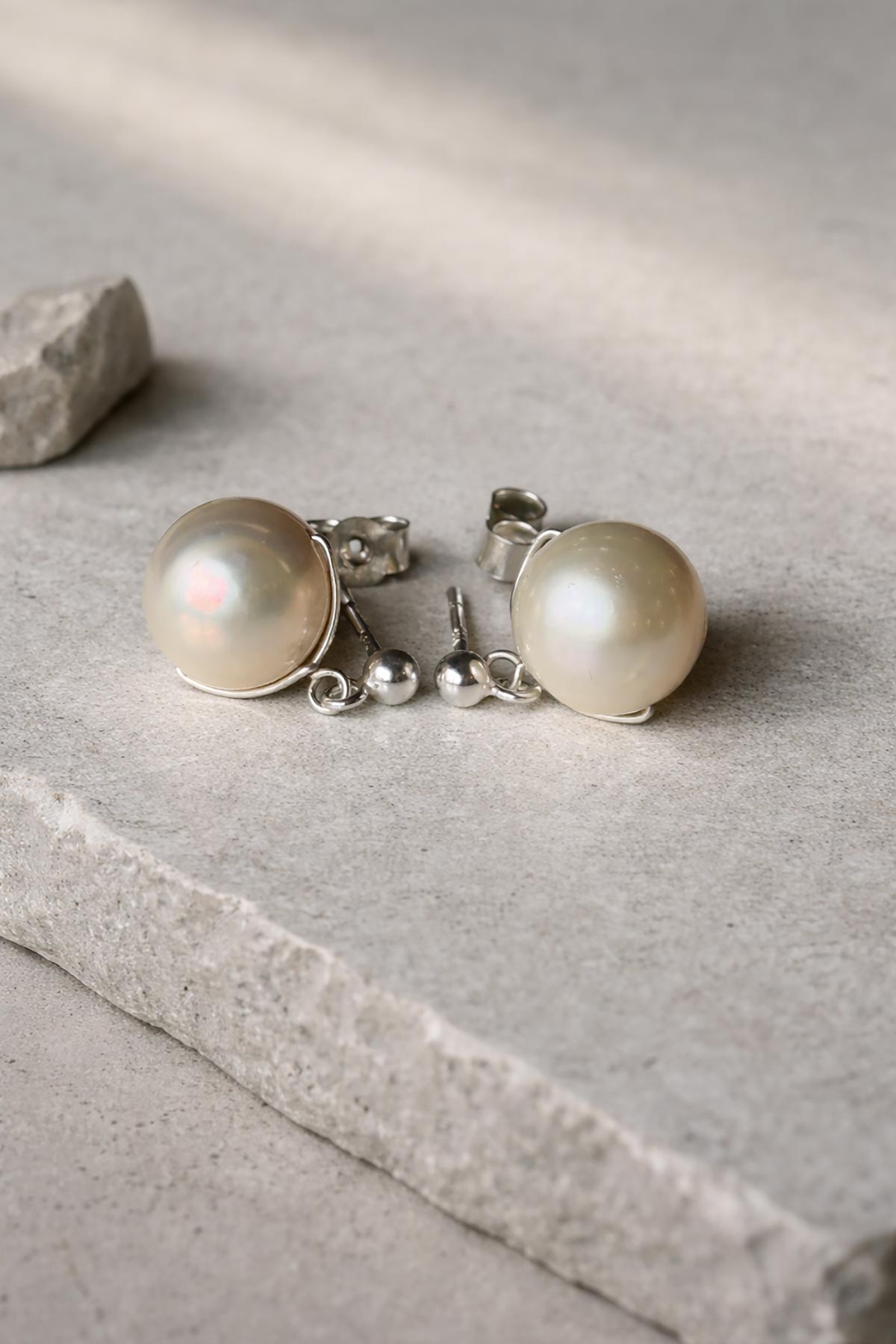 Pearl stud earrings detail view