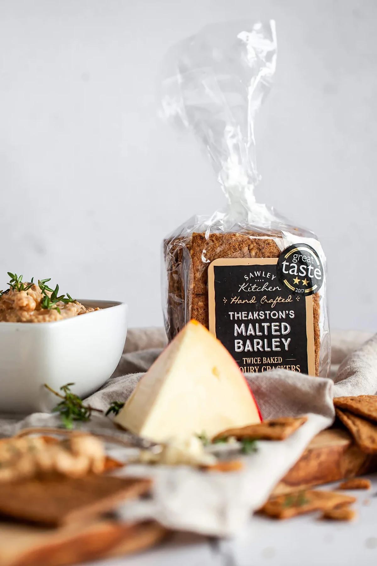 Crackers served on a cheese board