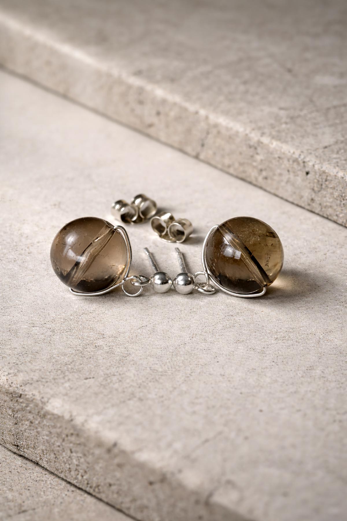 Close-up of smokey quartz gemstone stud earrings