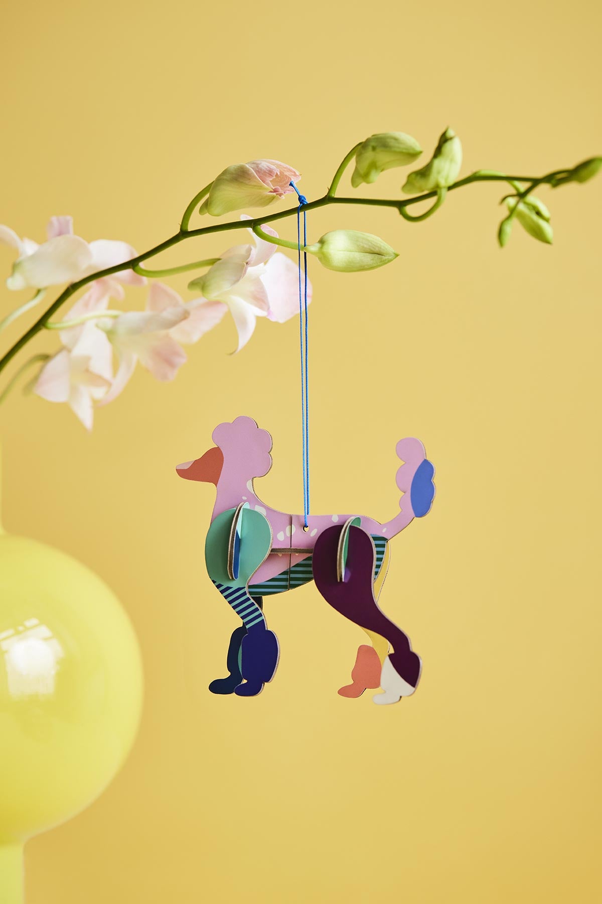 Poodle lucky charm styled as decor