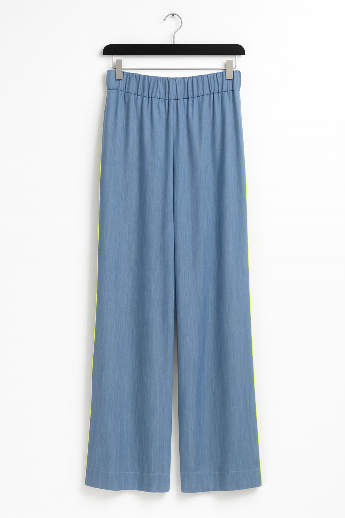 Close-up of Sunline Tencel Wide Leg Pants showing neon green side piping detail