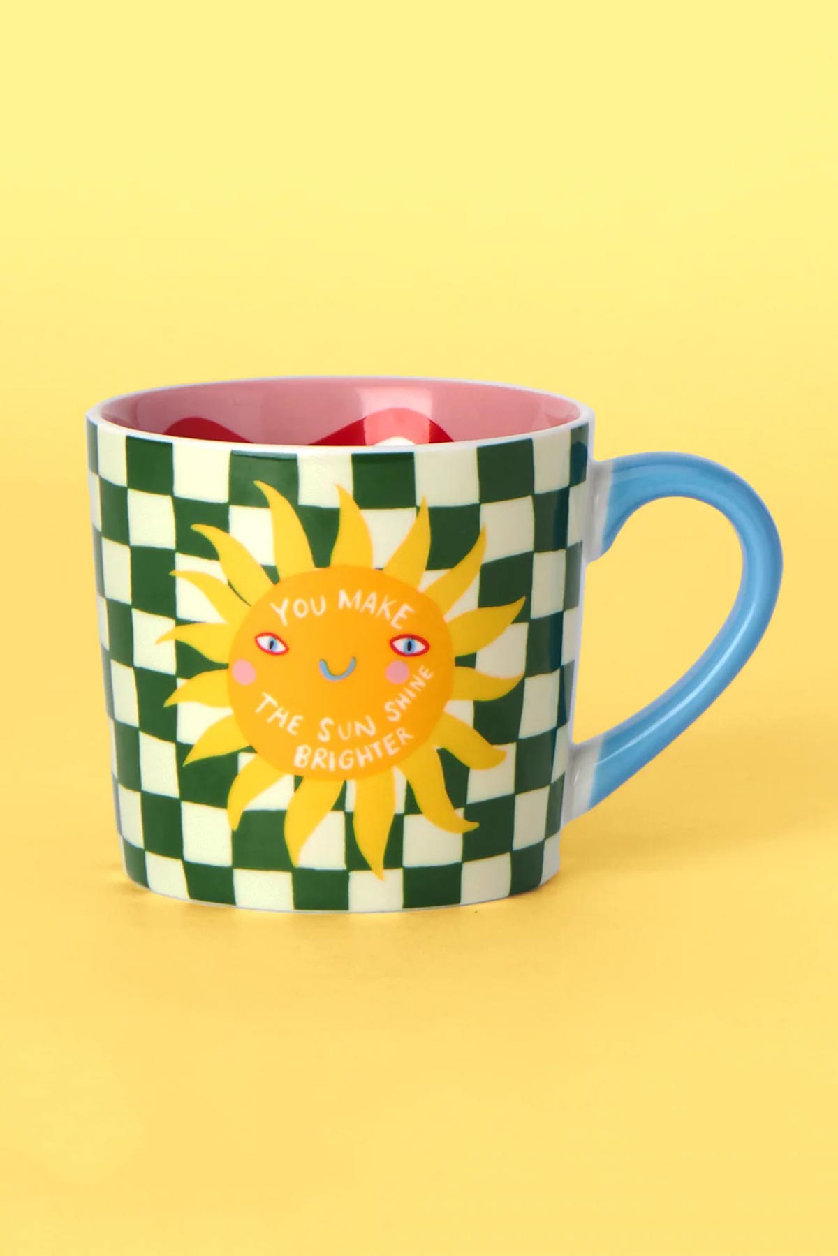 Hand-painted sunshine design detail on ceramic mug
