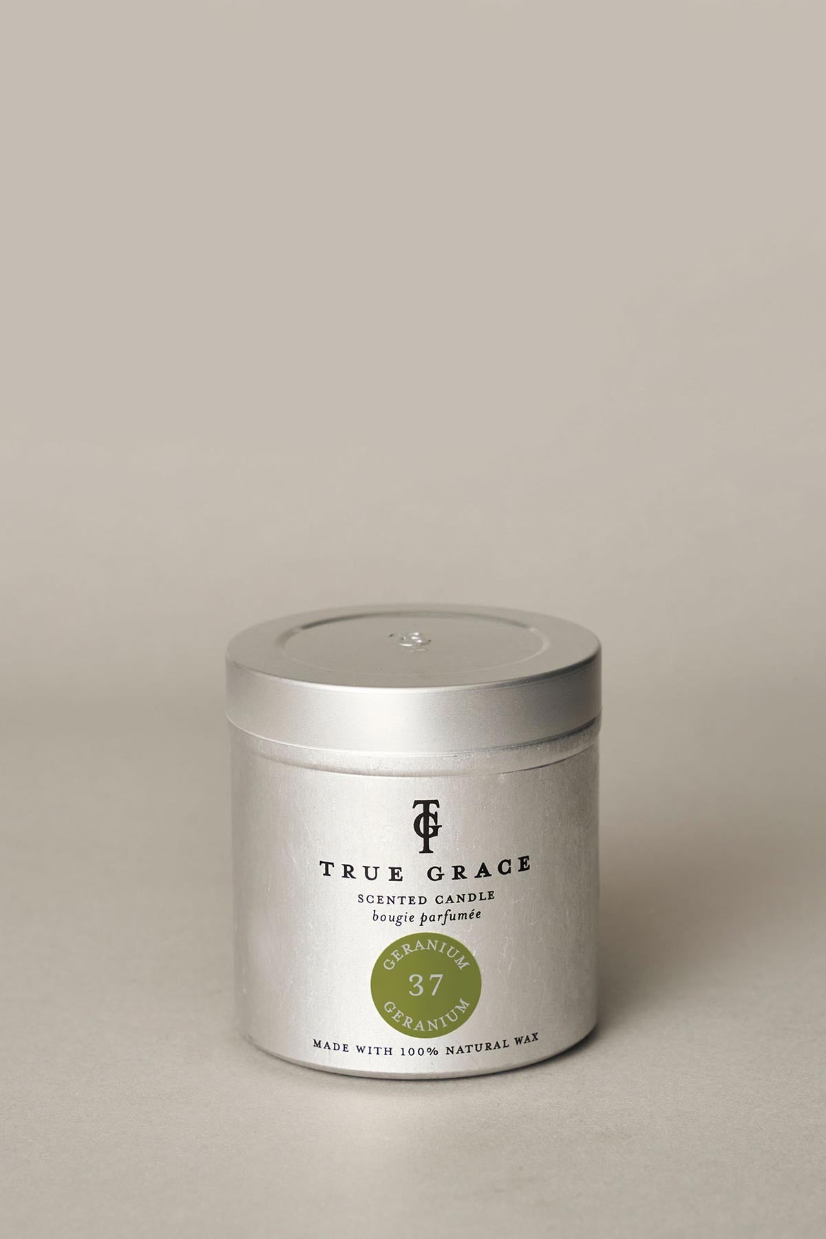 True Grace Geranium Tin Candle styled as fresh home fragrance