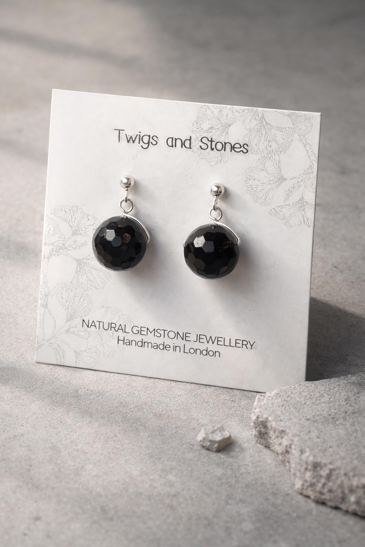 Close-up of black tourmaline gemstone stud earrings