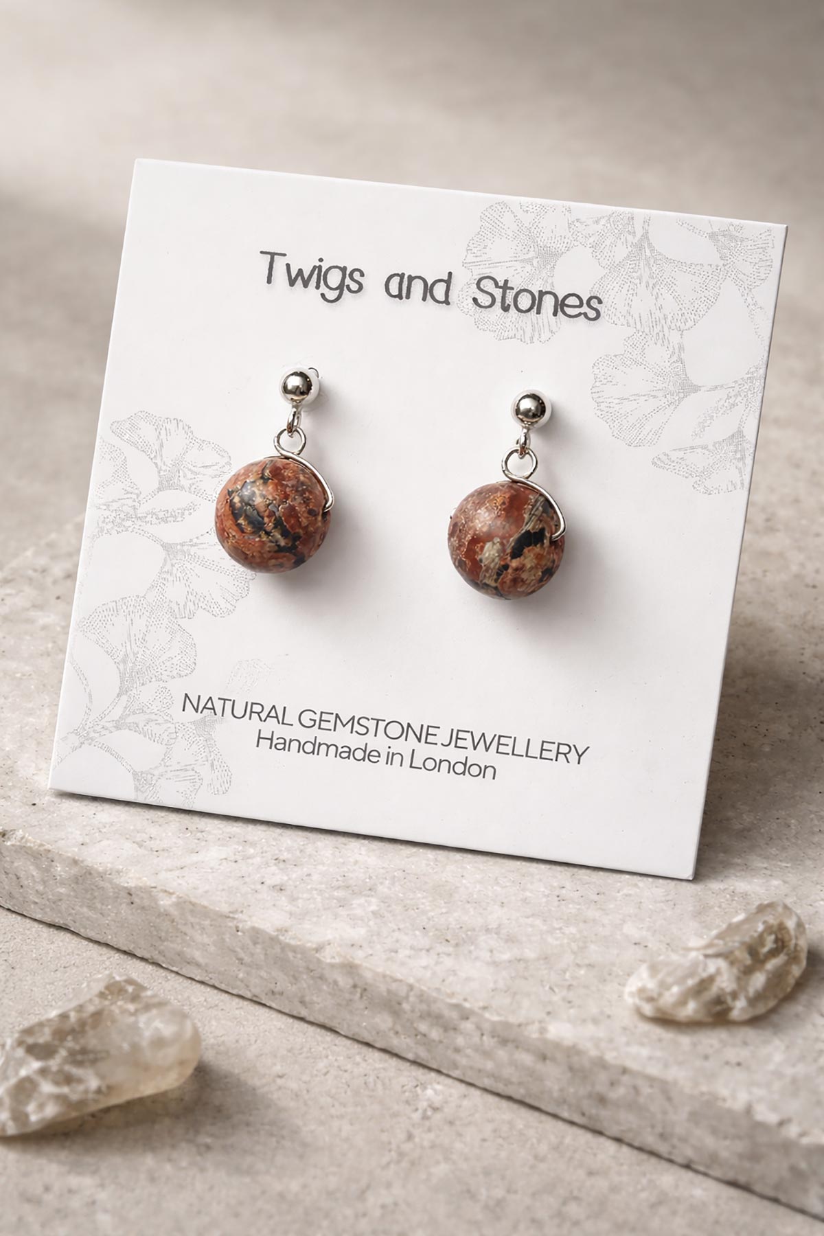 Close-up of leopard jasper gemstone stud earrings