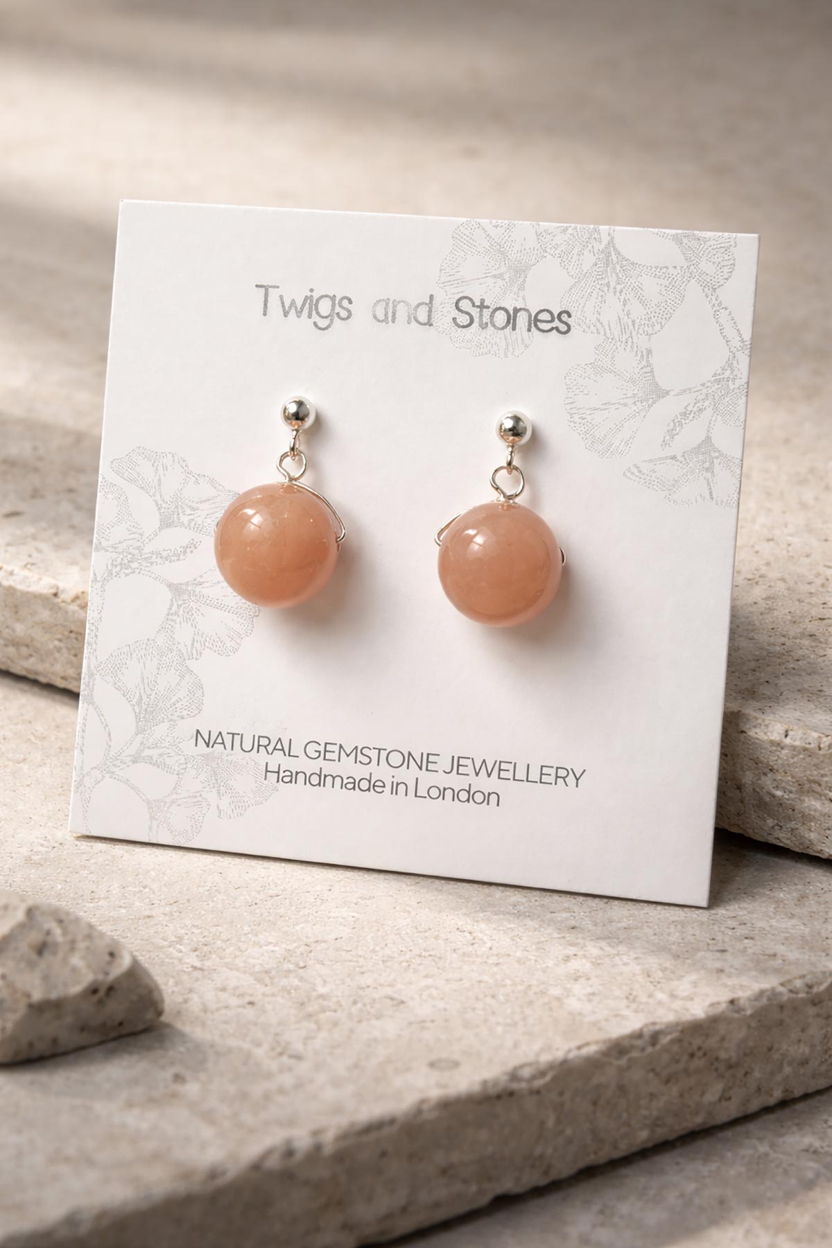 Close-up of peach moonstone gemstone stud earrings