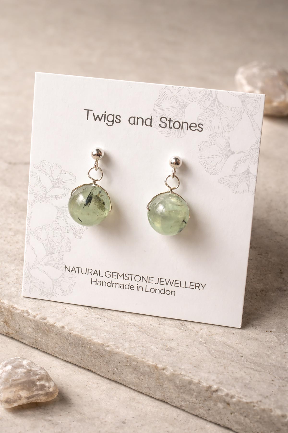 Close-up of prehnite gemstone stud earrings