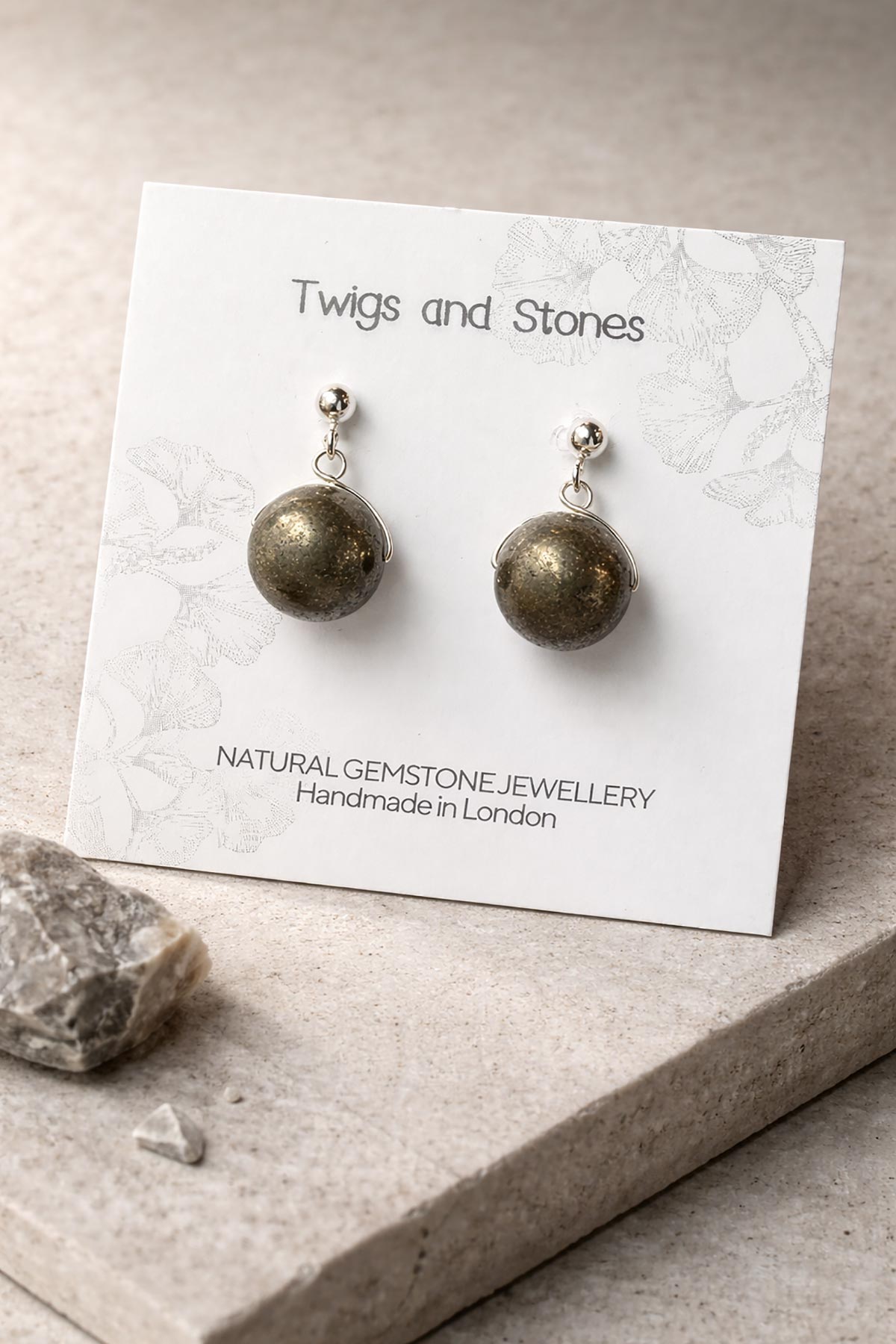 Close-up of pyrite gemstone stud earrings