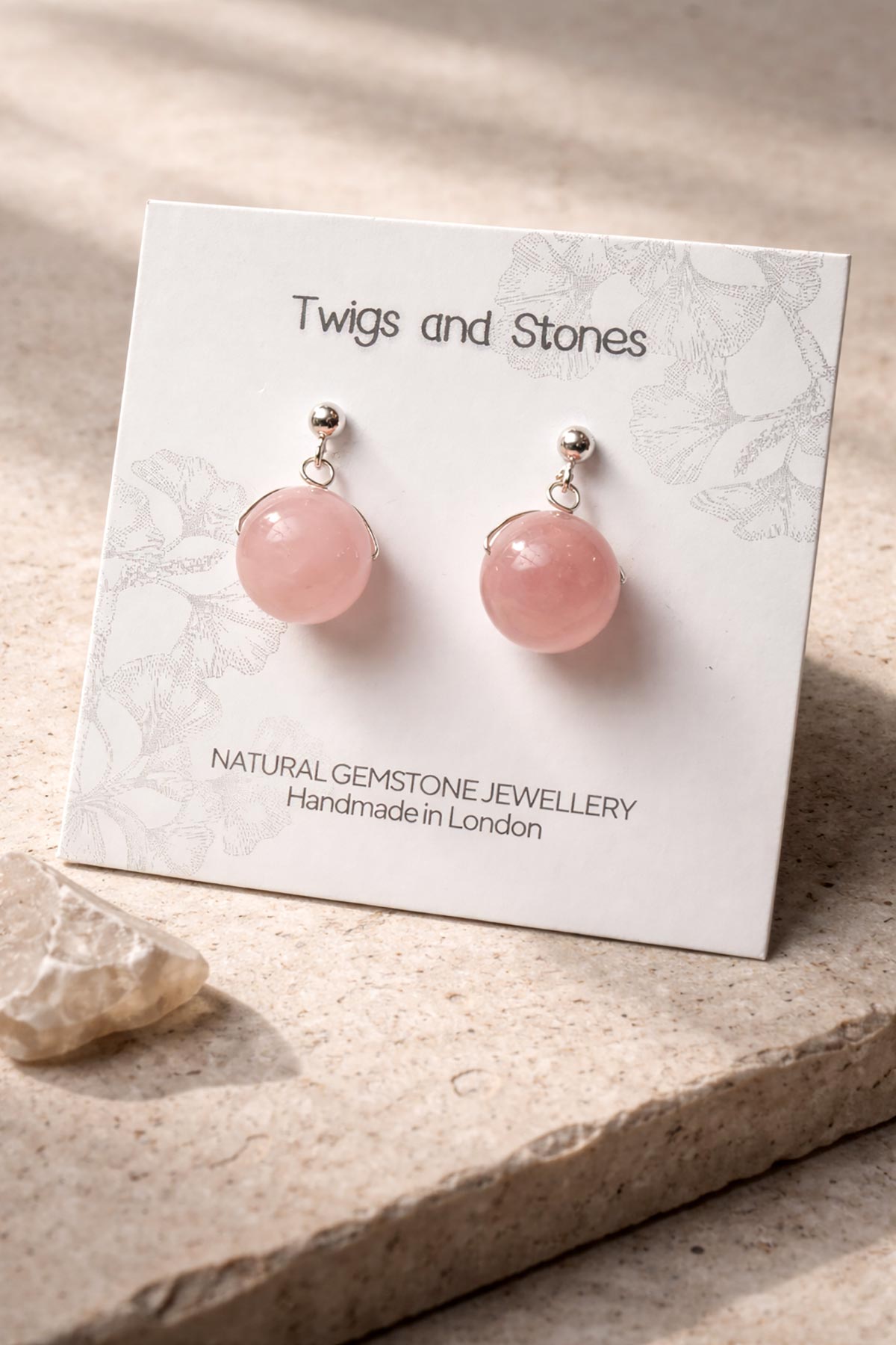 Twigs & Stones rose quartz earrings in packaging
