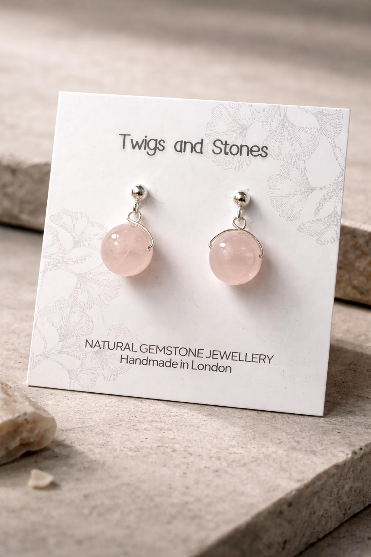Close-up of rose quartz gemstone stud earrings