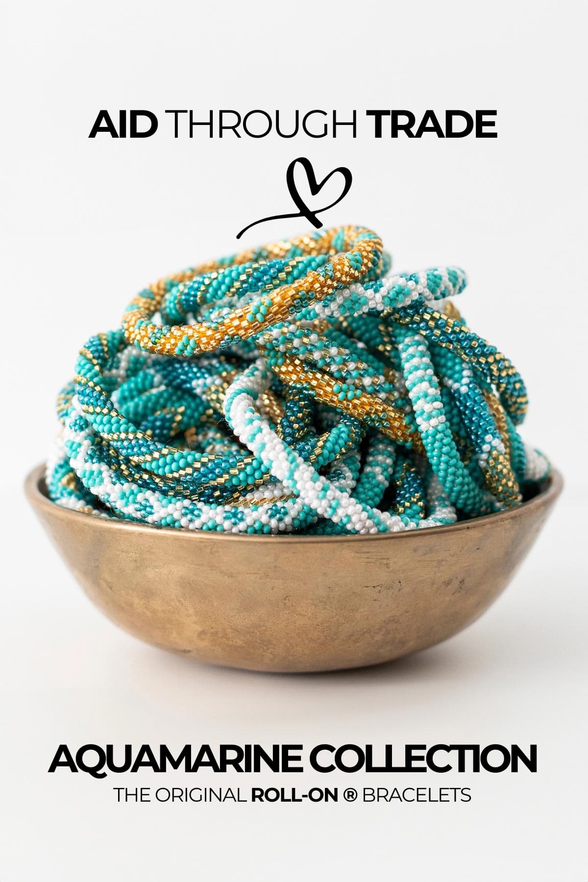 Aquamarine beaded Roll-On bracelets in turquoise white and gold piled in a brass bowl — Urban Wild