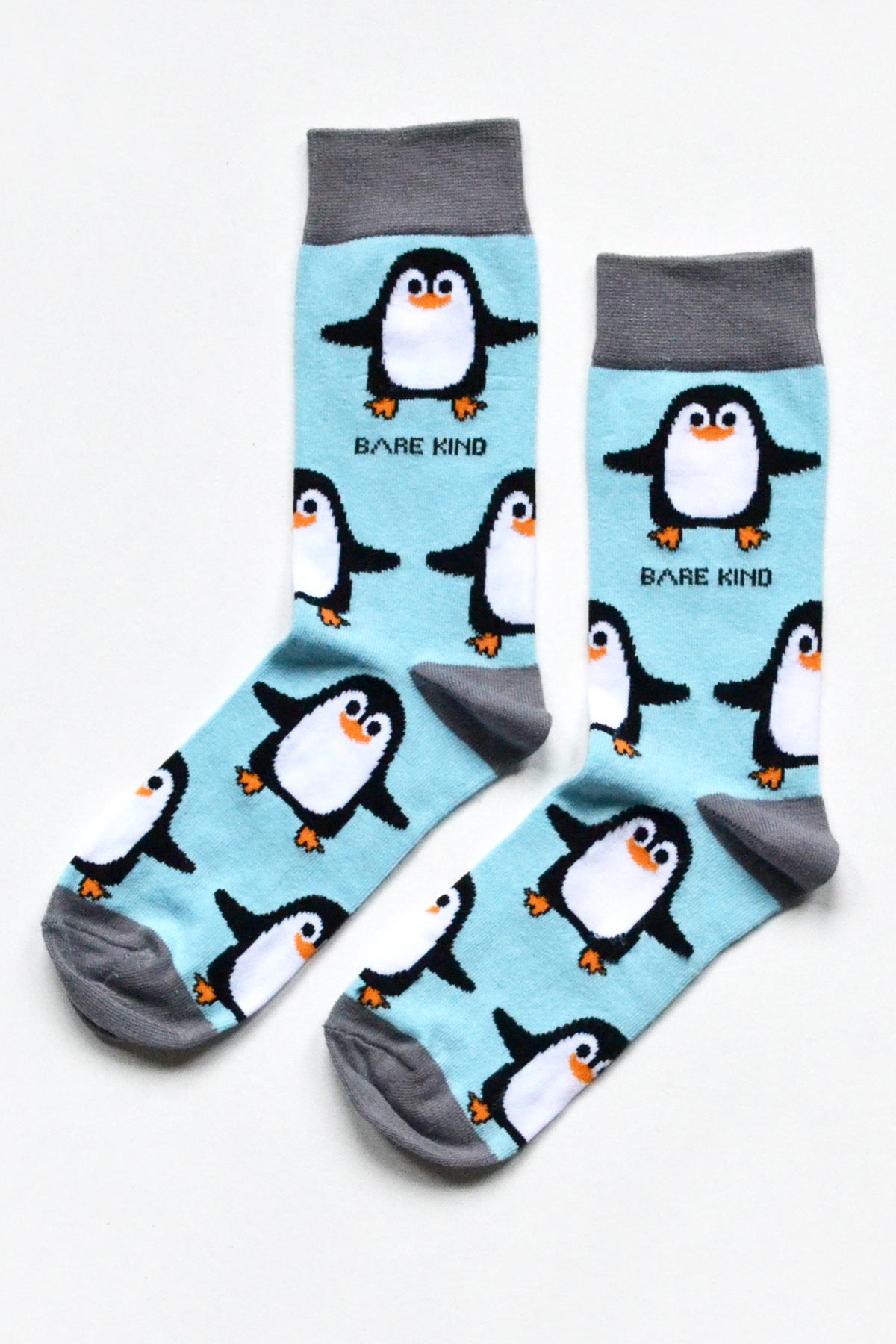 Blue bamboo crew socks featuring waddling penguin print and grey toe heel Urban Wild