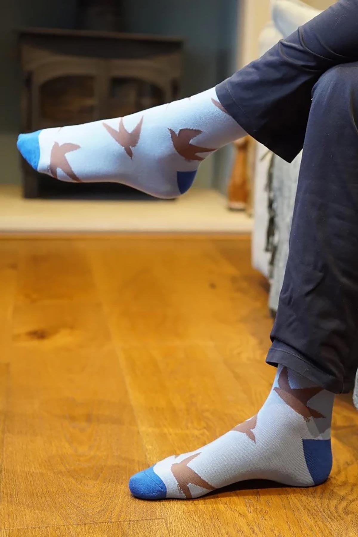 Blue bamboo crew socks with brown swift bird print worn at home — Urban Wild