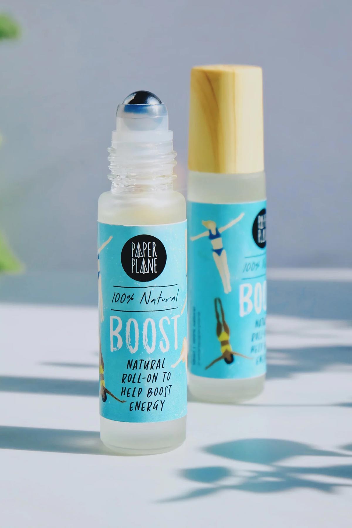 Two Boost natural energy pulse point roller oil bottles in sunlight — Urban Wild