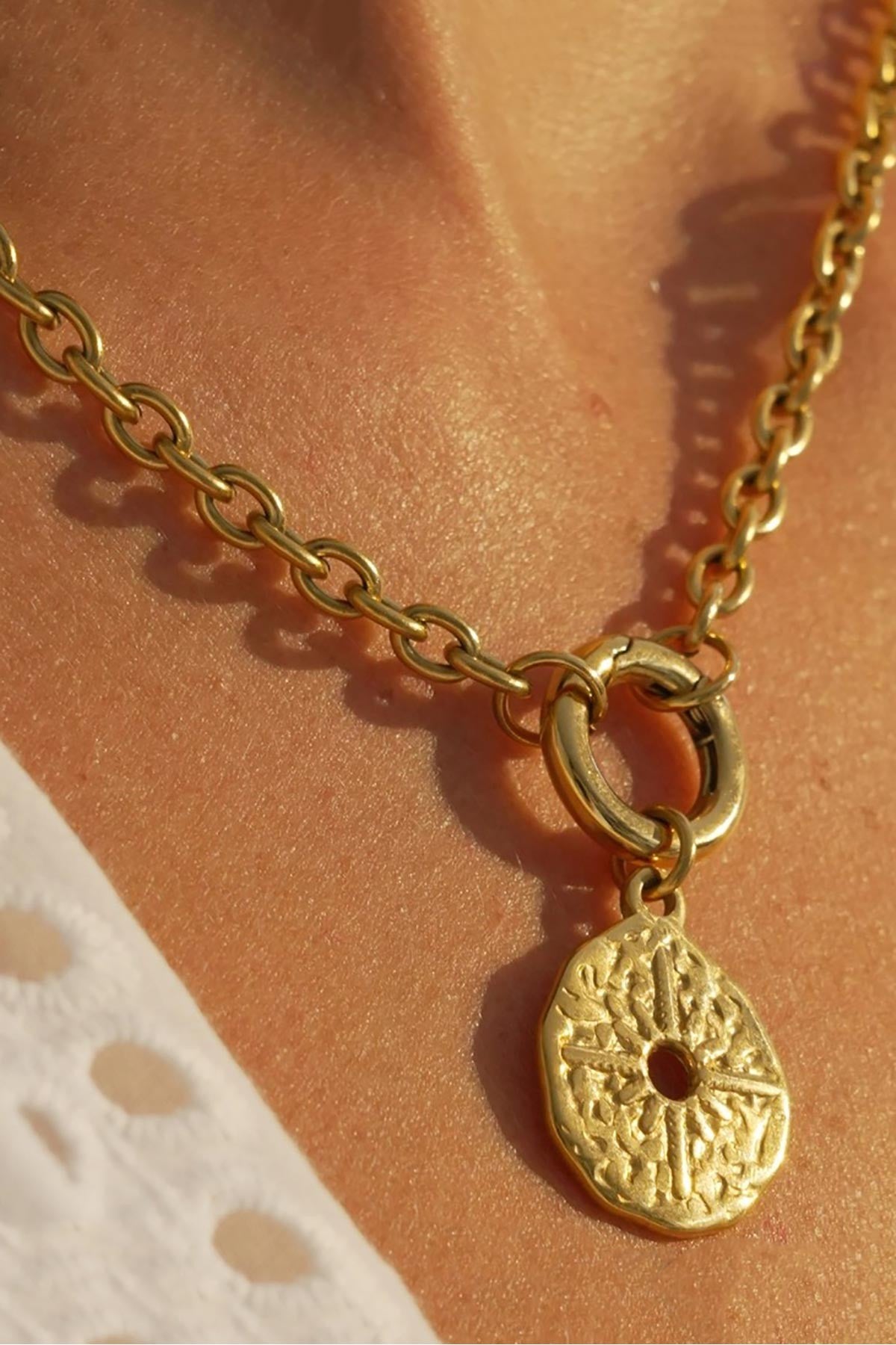 Waterproof gold stainless steel sunburst pendant necklace styling view — Urban Wild