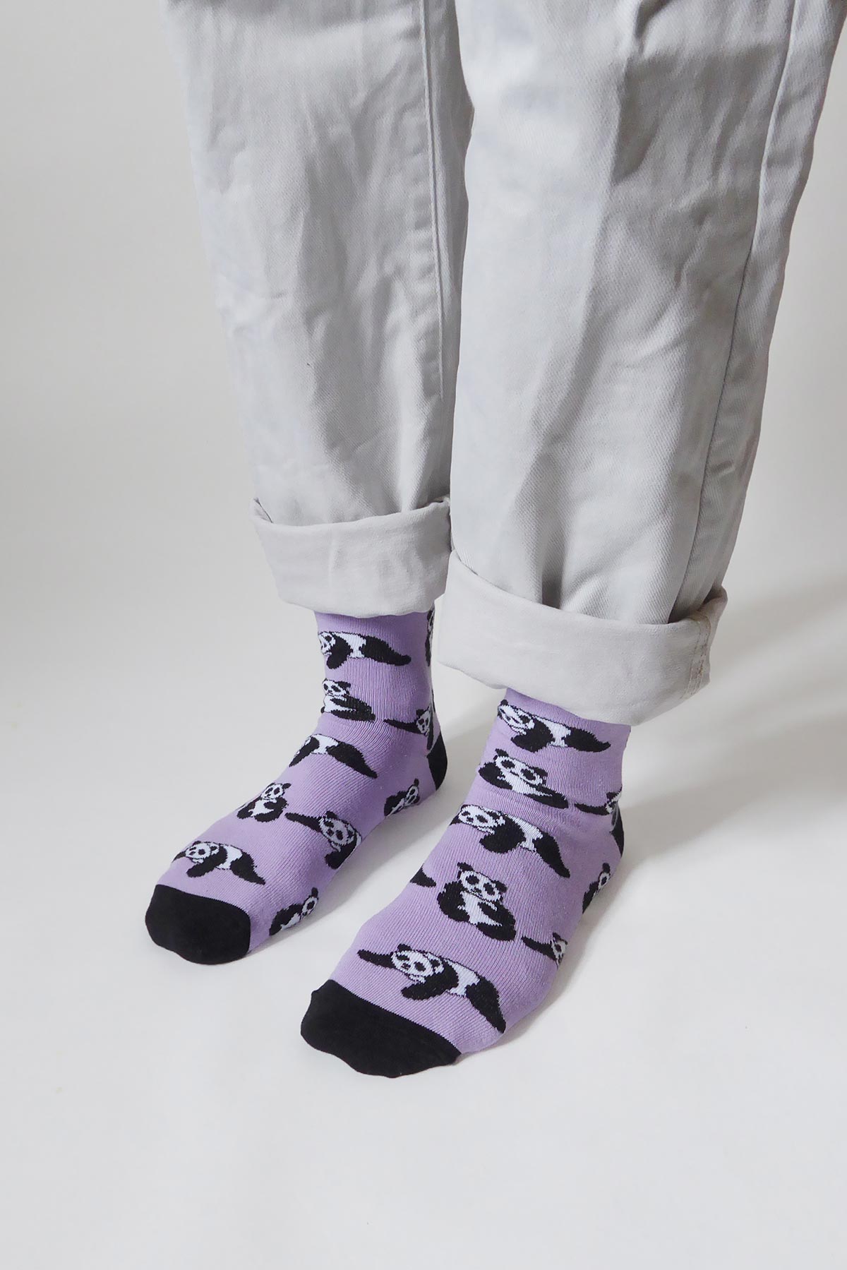 Lilac panda bamboo crew socks styled with white turn-up trousers — Urban Wild