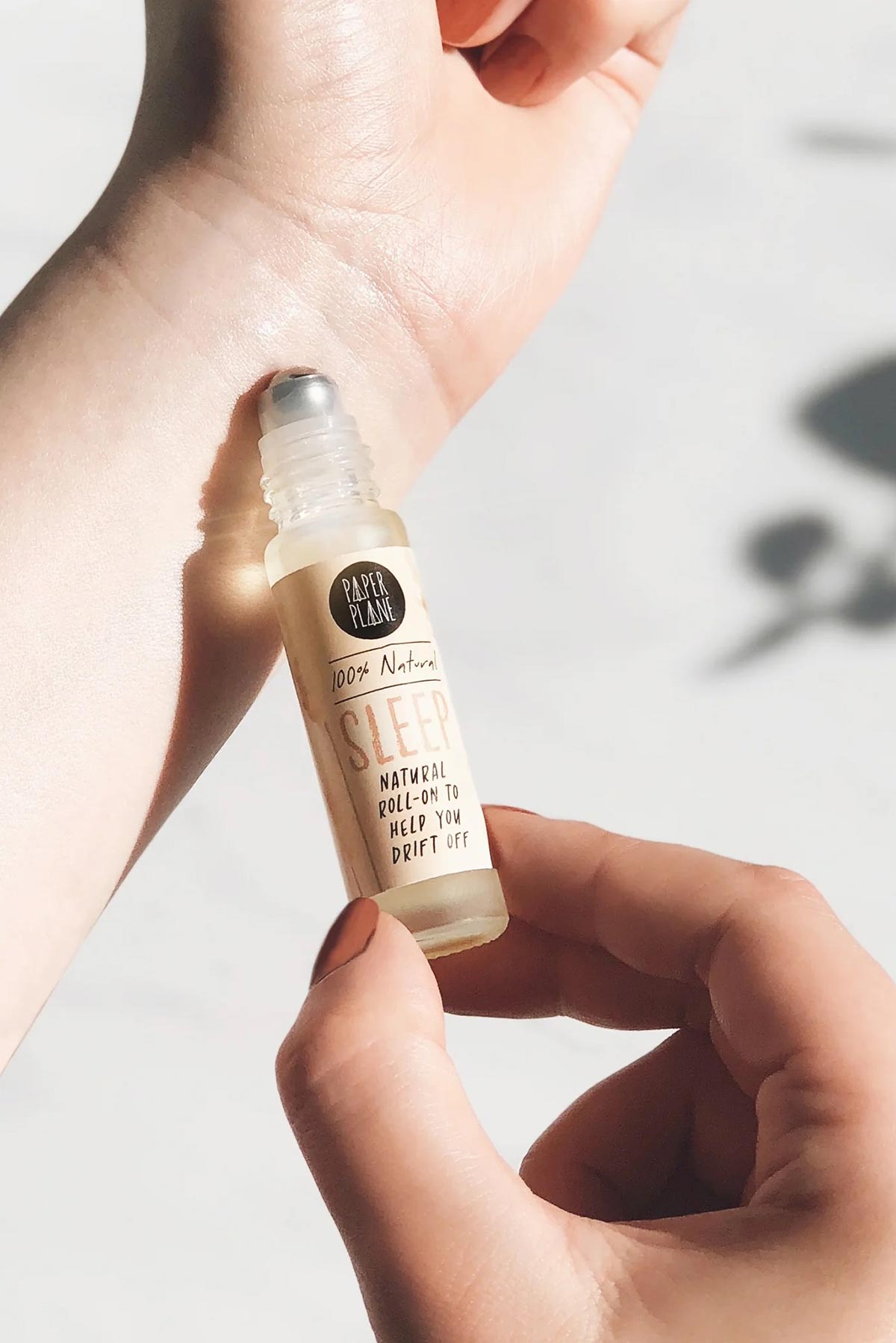 Applying natural sleep roller oil to wrist pulse point — Urban Wild