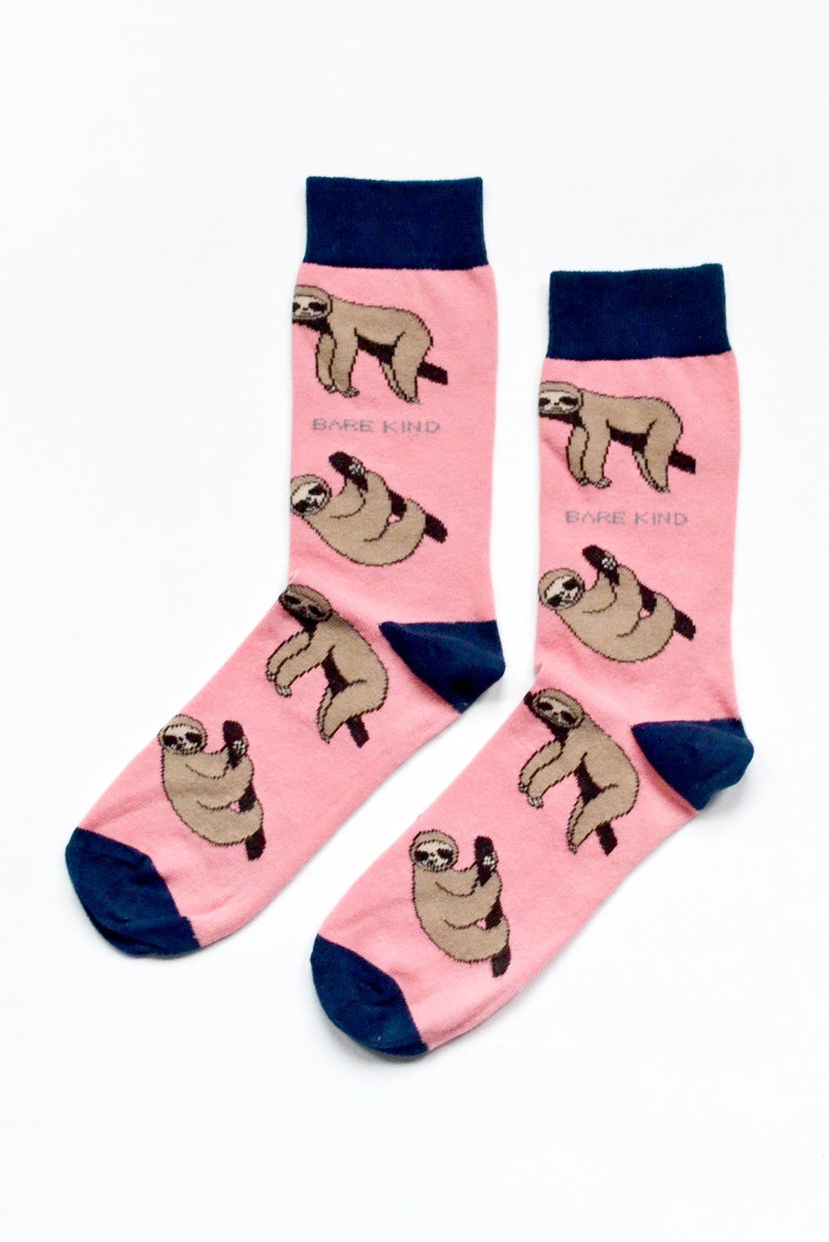 Pair of pink bamboo sloth crew socks with navy cuff, heel and toe — Urban Wild