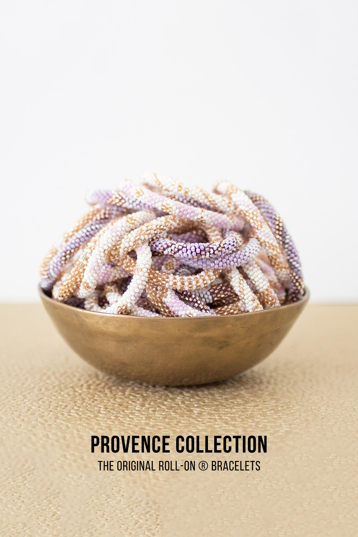 Provence beaded Roll-On bracelets in lilac white and gold in brass bowl — Urban Wild