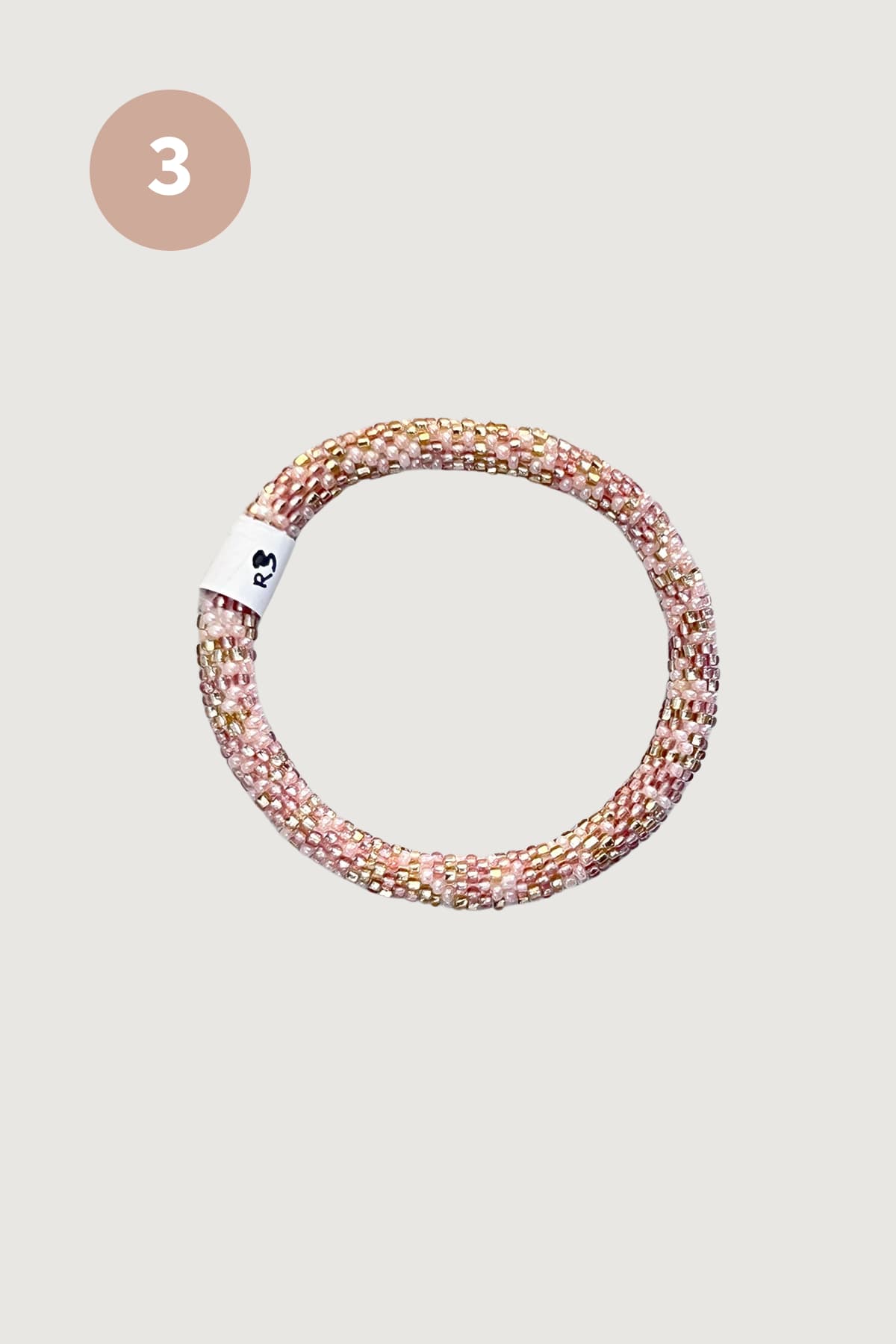 Soft pink and gold beaded Roll-On bracelet design three handmade in Nepal - Urban Wild
