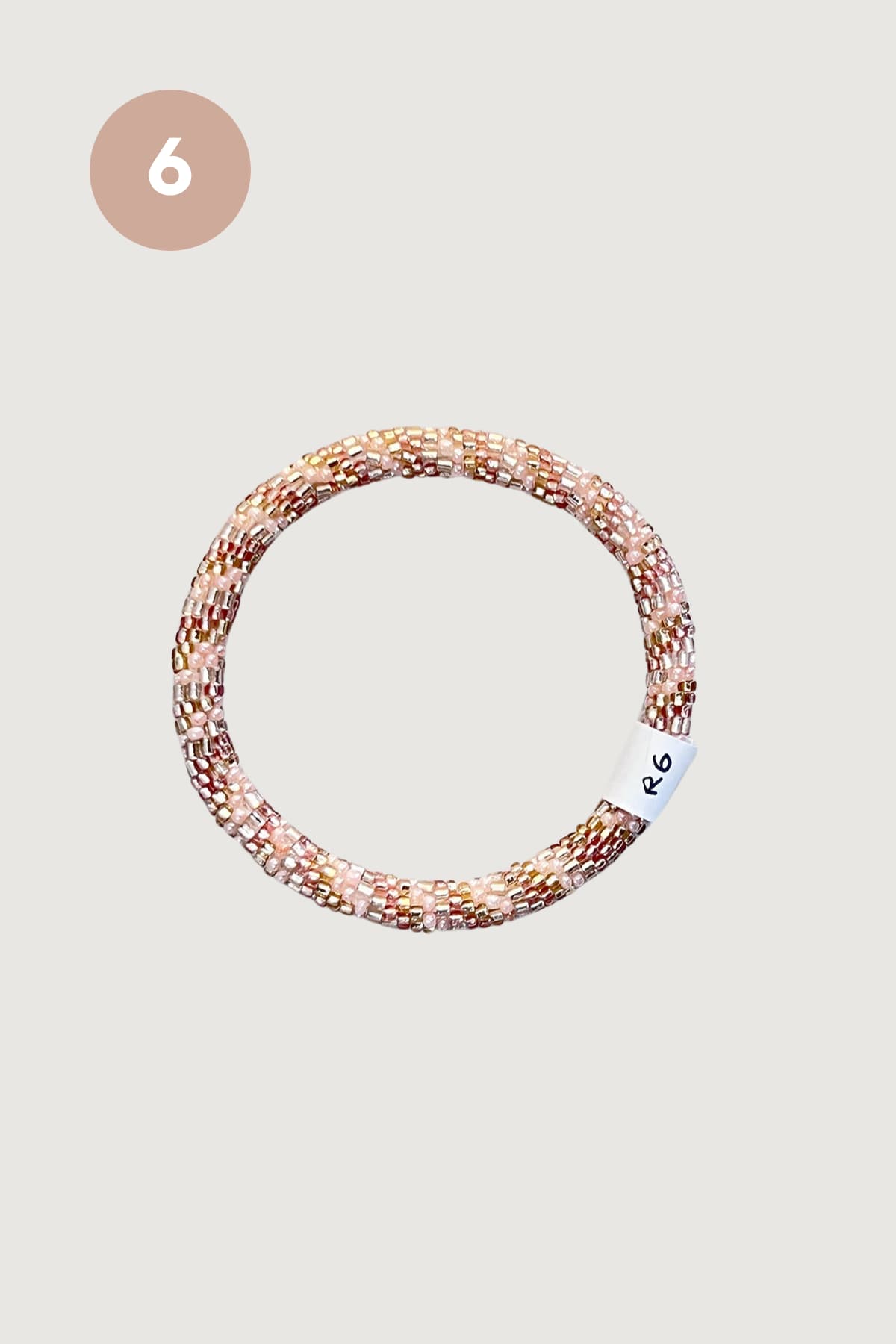 Rose pink and gold beaded Roll-On bracelet design six handmade in Nepal - Urban Wild