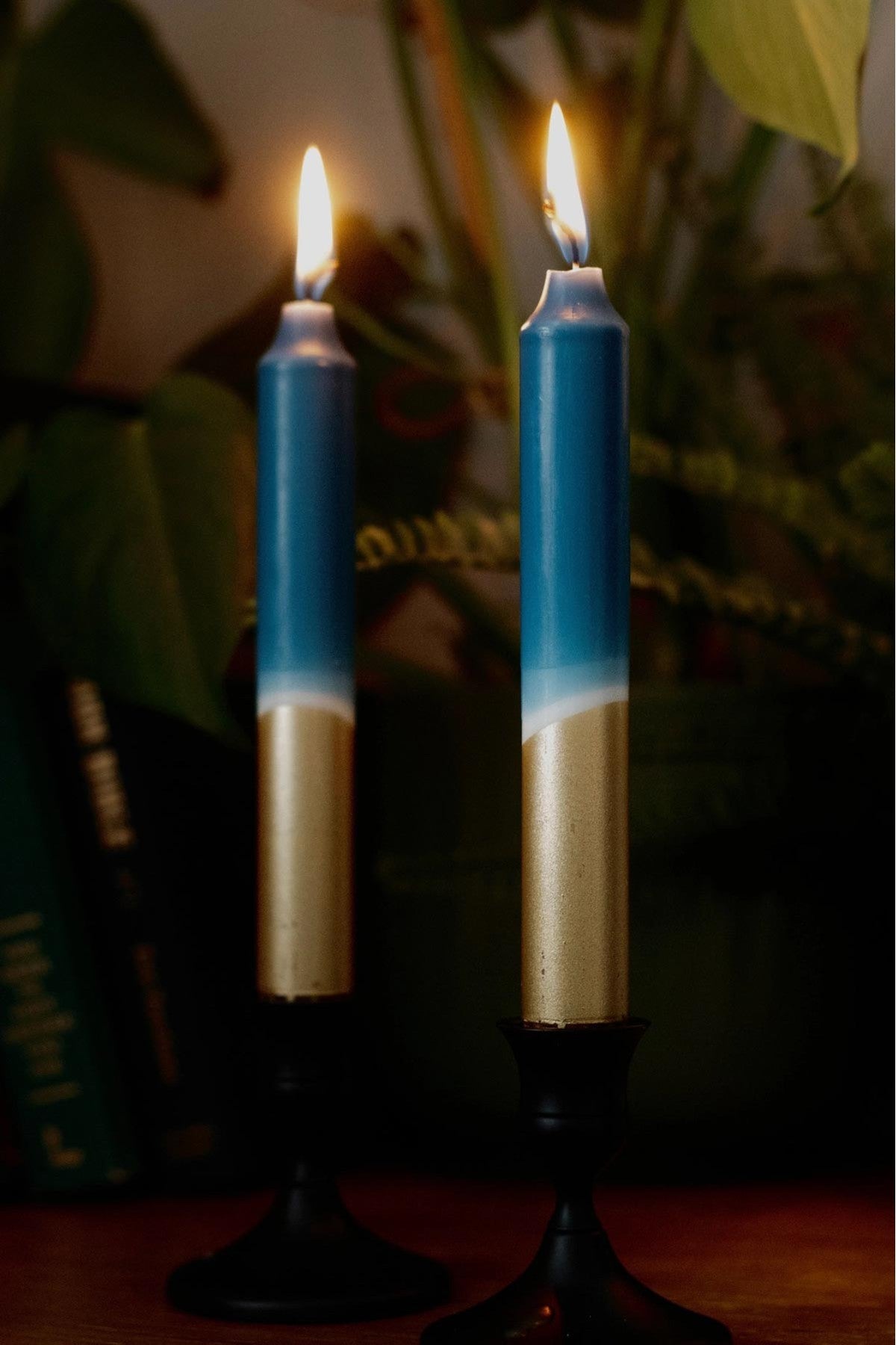 Hand dipped teal and gold taper candles styled on dining table — Urban Wild