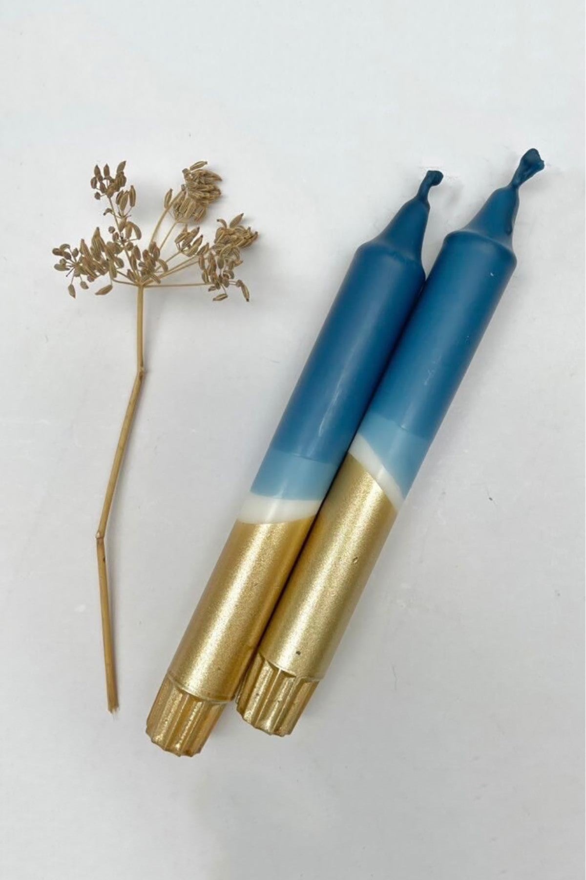 The Singing Rabbit teal blue gold dip dyed candle pair detail — Urban Wild