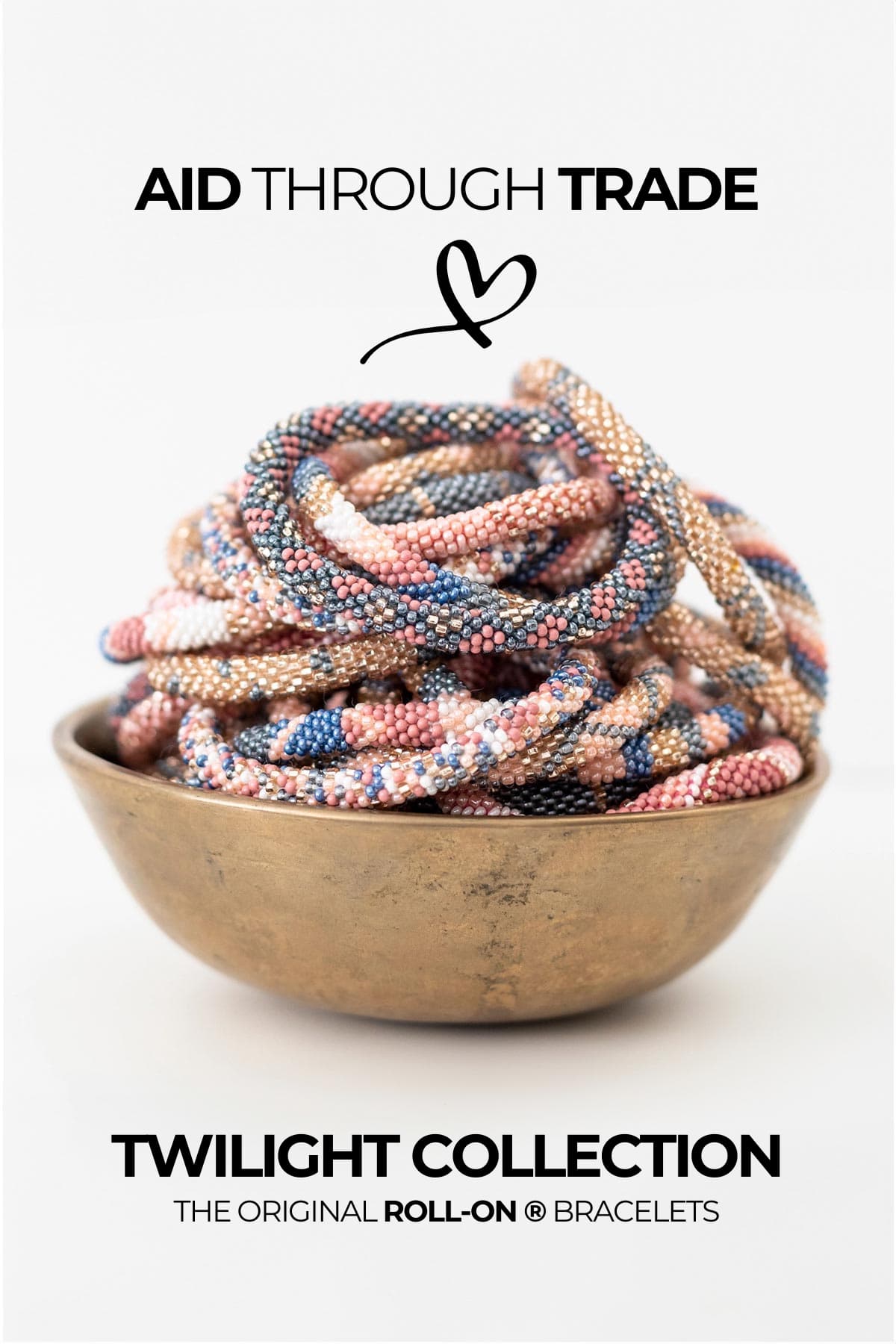 Twilight beaded Roll-On bracelets in dusky pink blue and gold tones piled in a brass bowl — Urban Wild