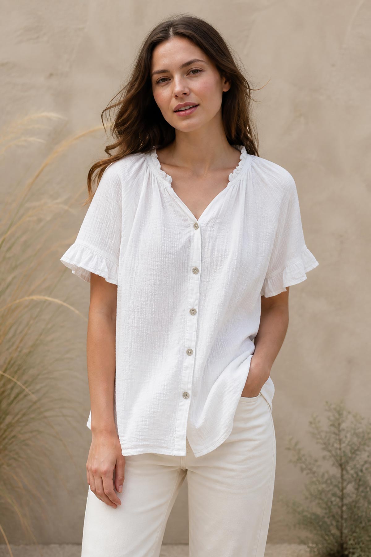 Detail view of white cotton gypsy top with relaxed fit